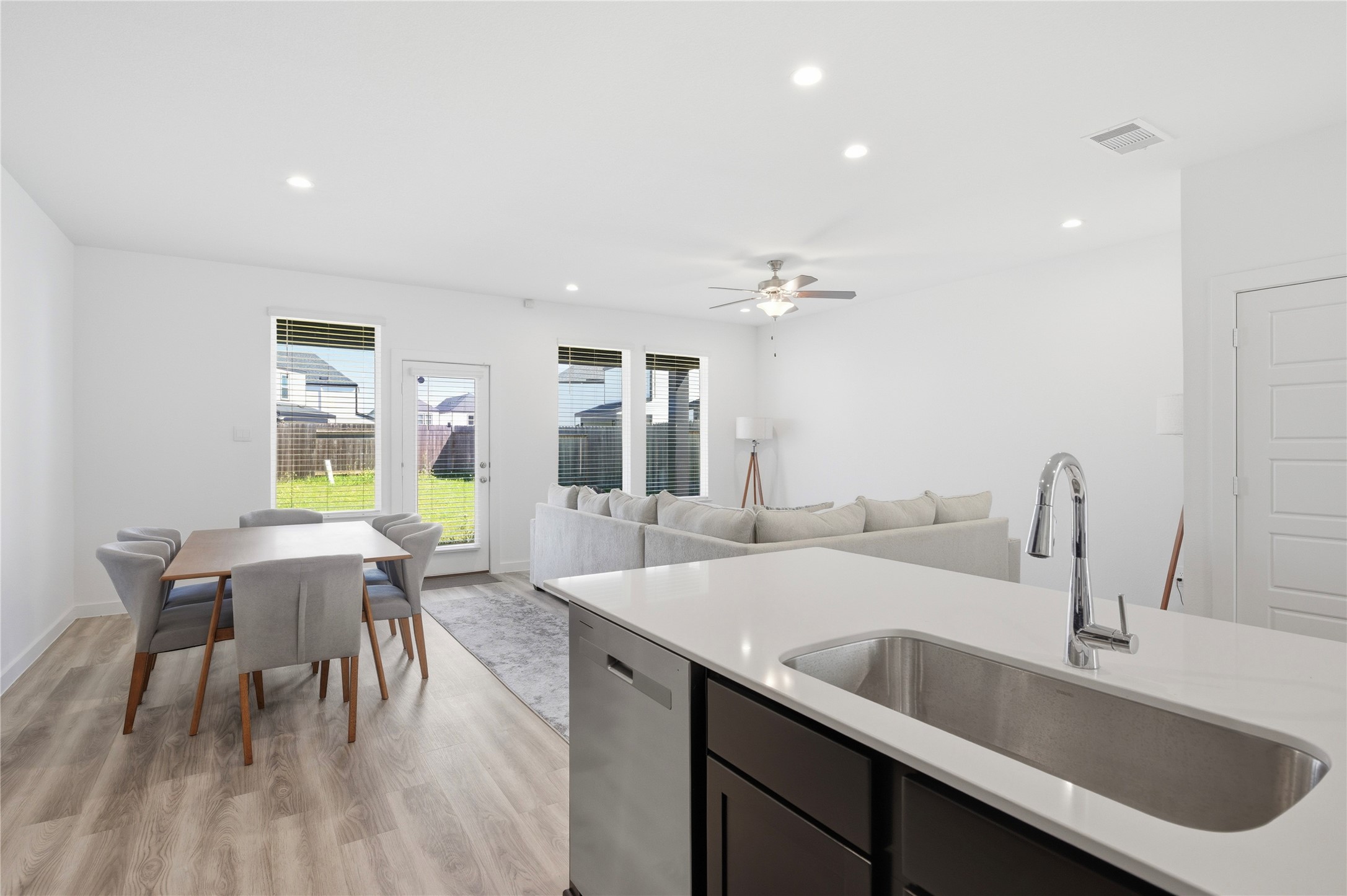 Large stainless steel sink overlooks the living and dining areas.