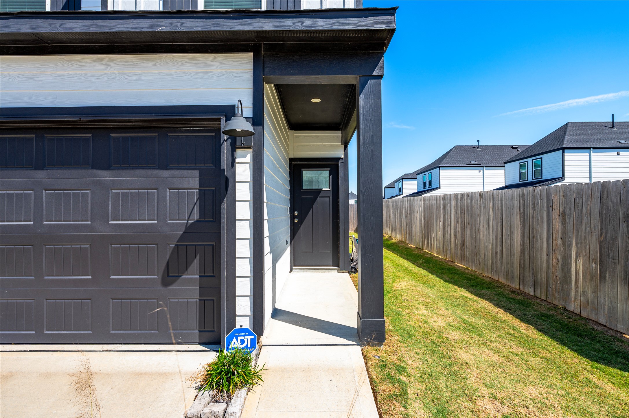 Covered walkway leading to the front entryway of the home.