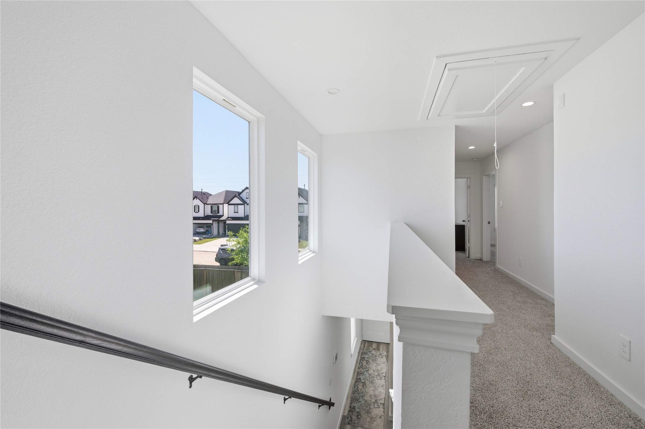 Staircase leads to the 2nd level with great natural lighting.
