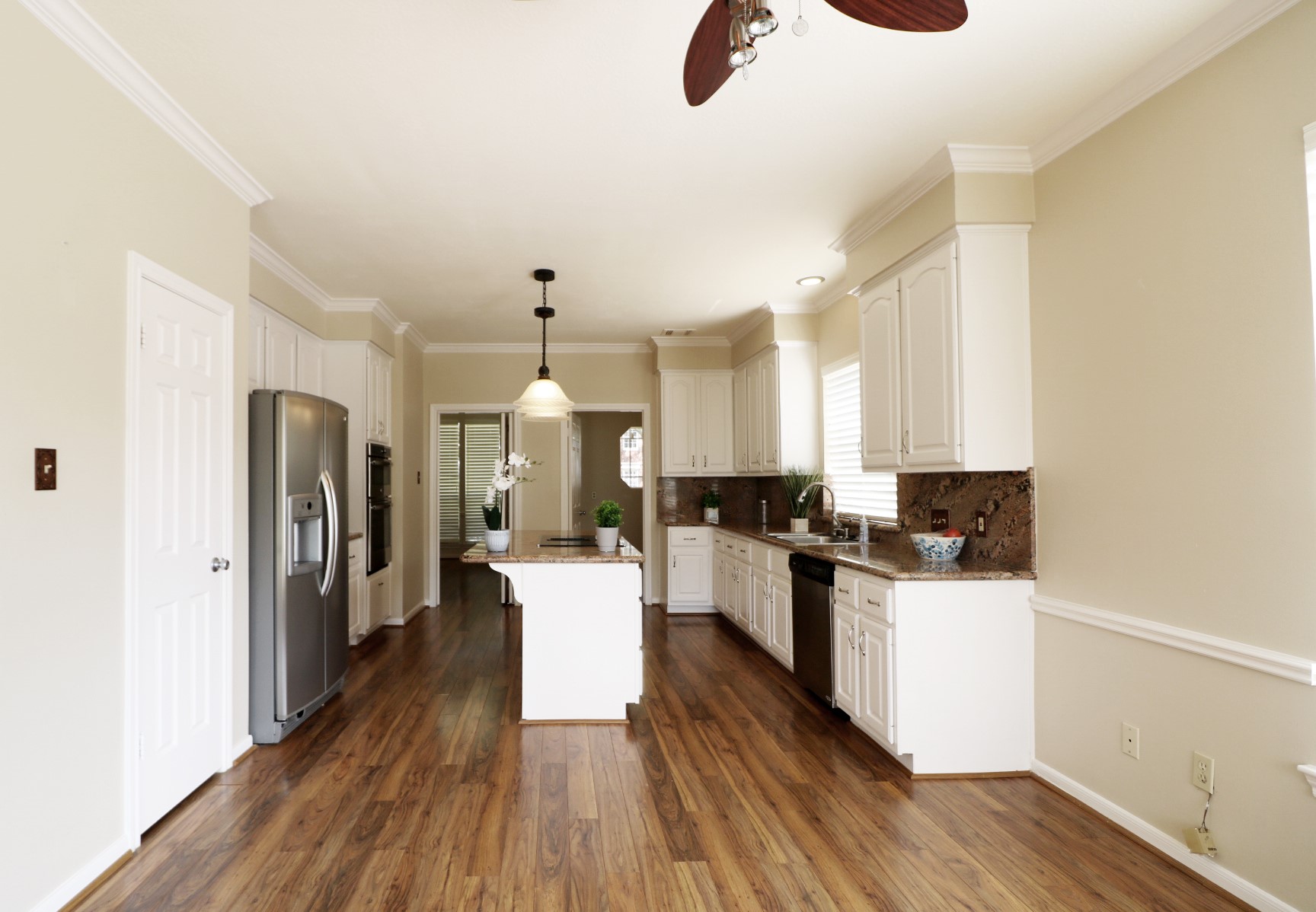 Kitchen with refrigerator and granite countertops