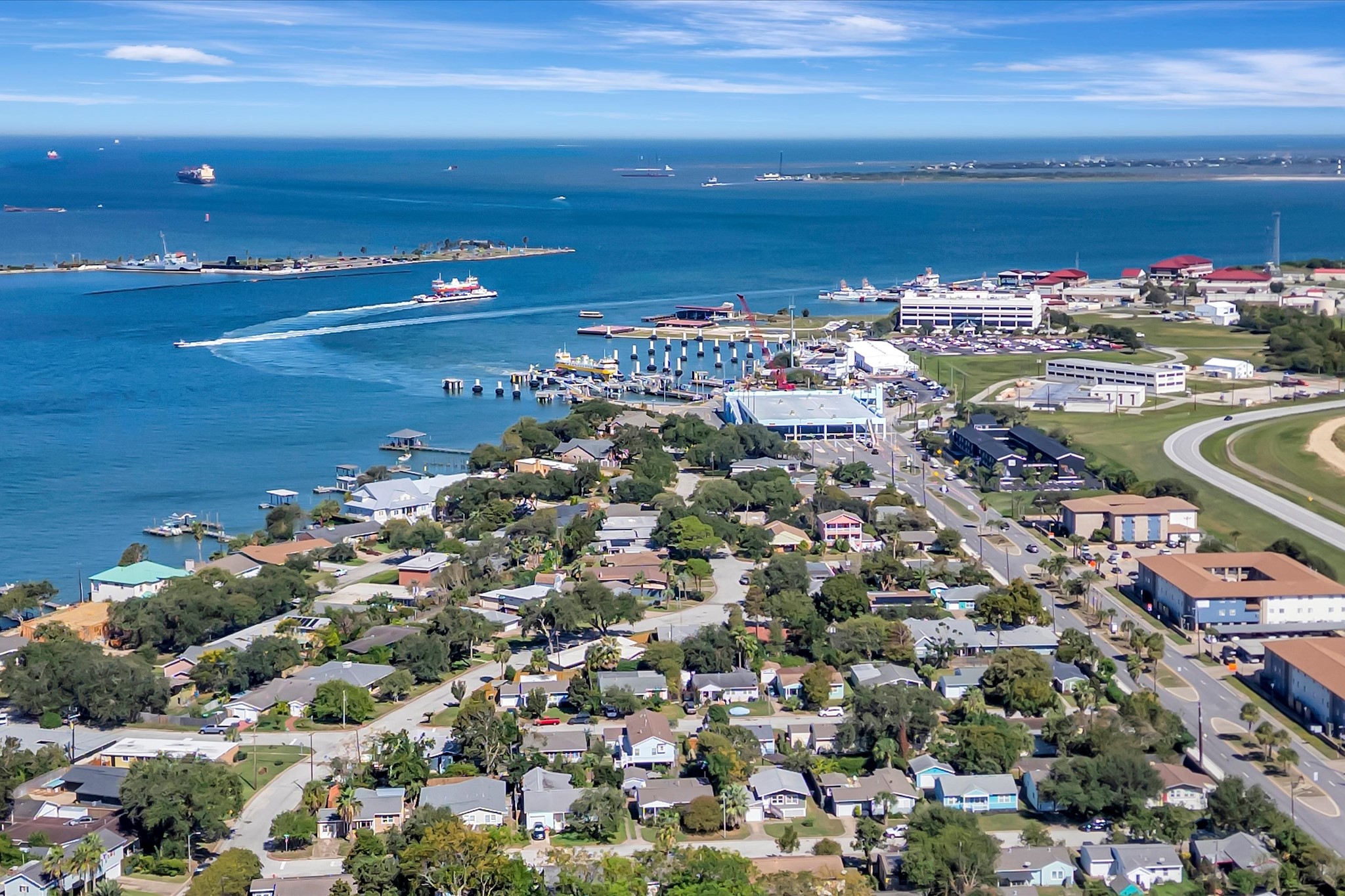 Aerial perspective of the surrounding neighborhood and Galveston waterways.