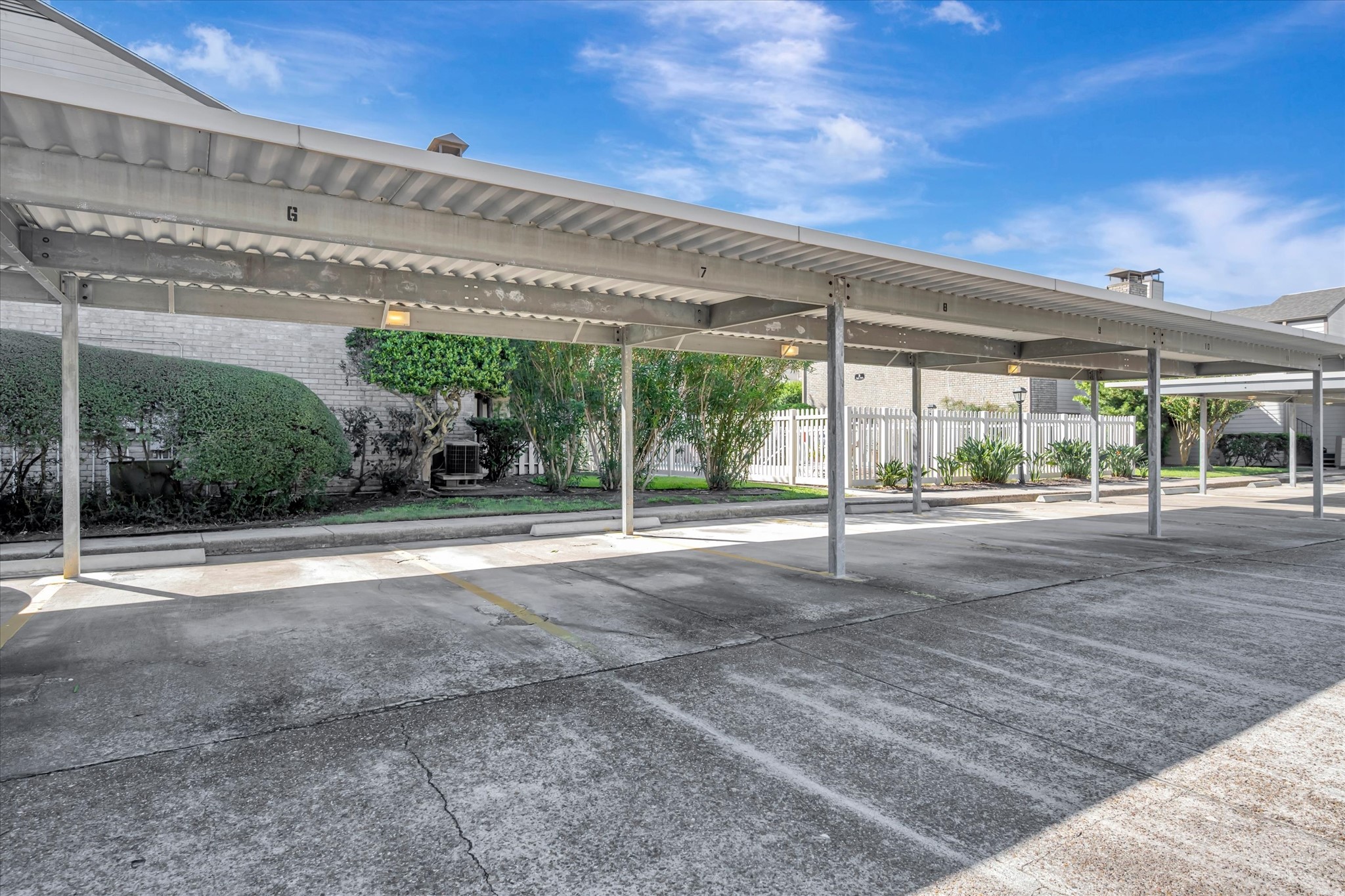 Covered parking area within the condominium community.