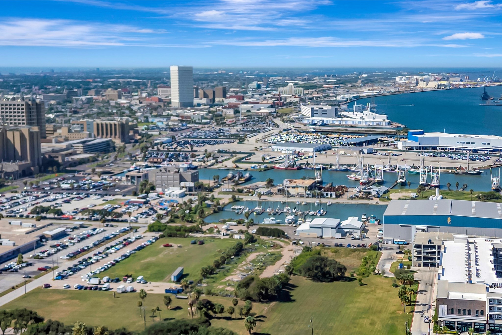 Wide aerial view places the community within Galvestons coastal landscape.