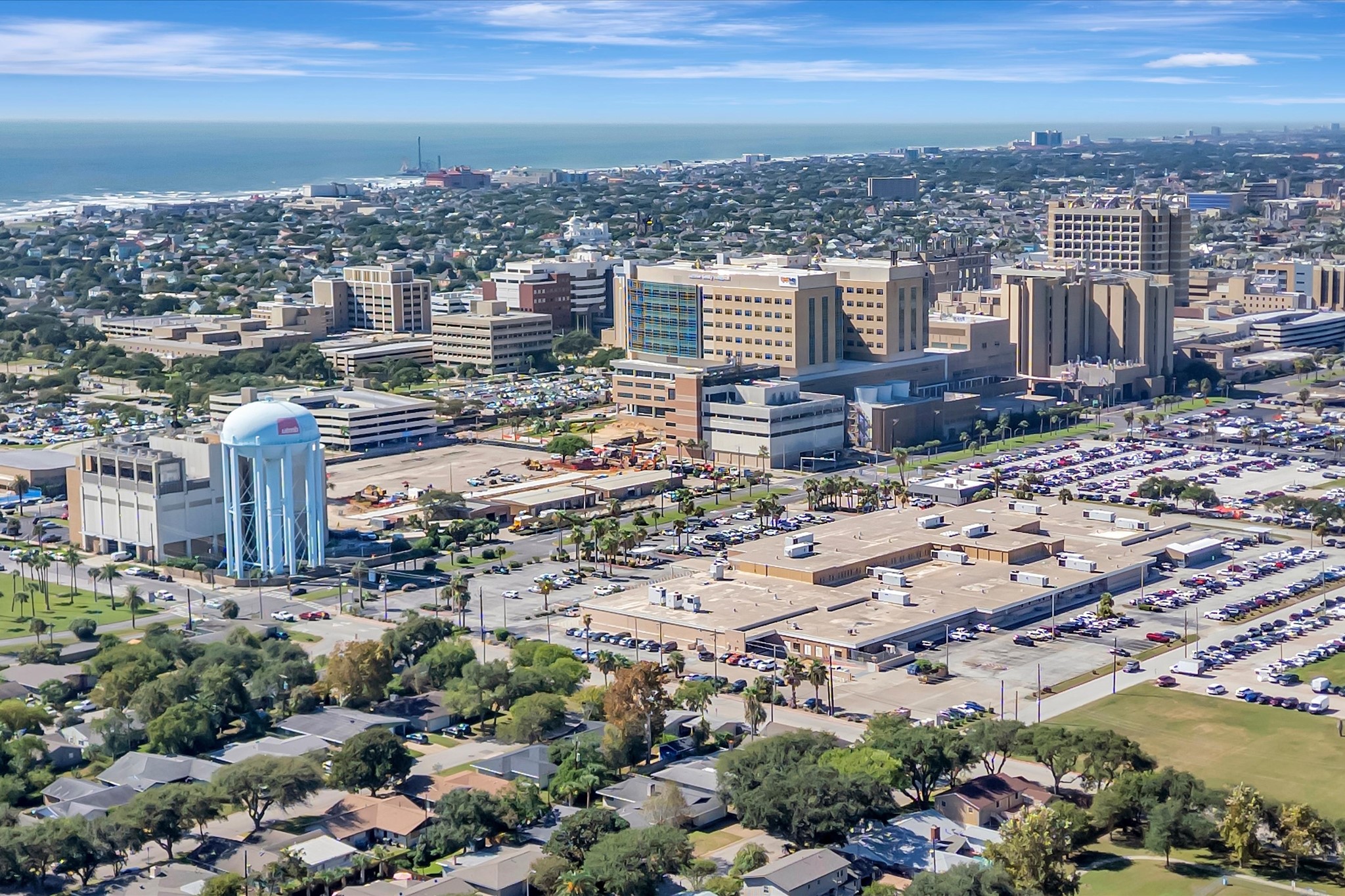 Aerial perspective showing nearby development and the surrounding island setting.