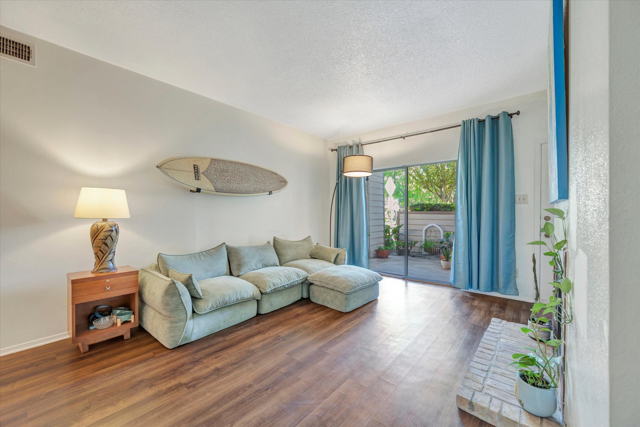 Sliding glass doors bring natural light into the living area and provide access to the patio.