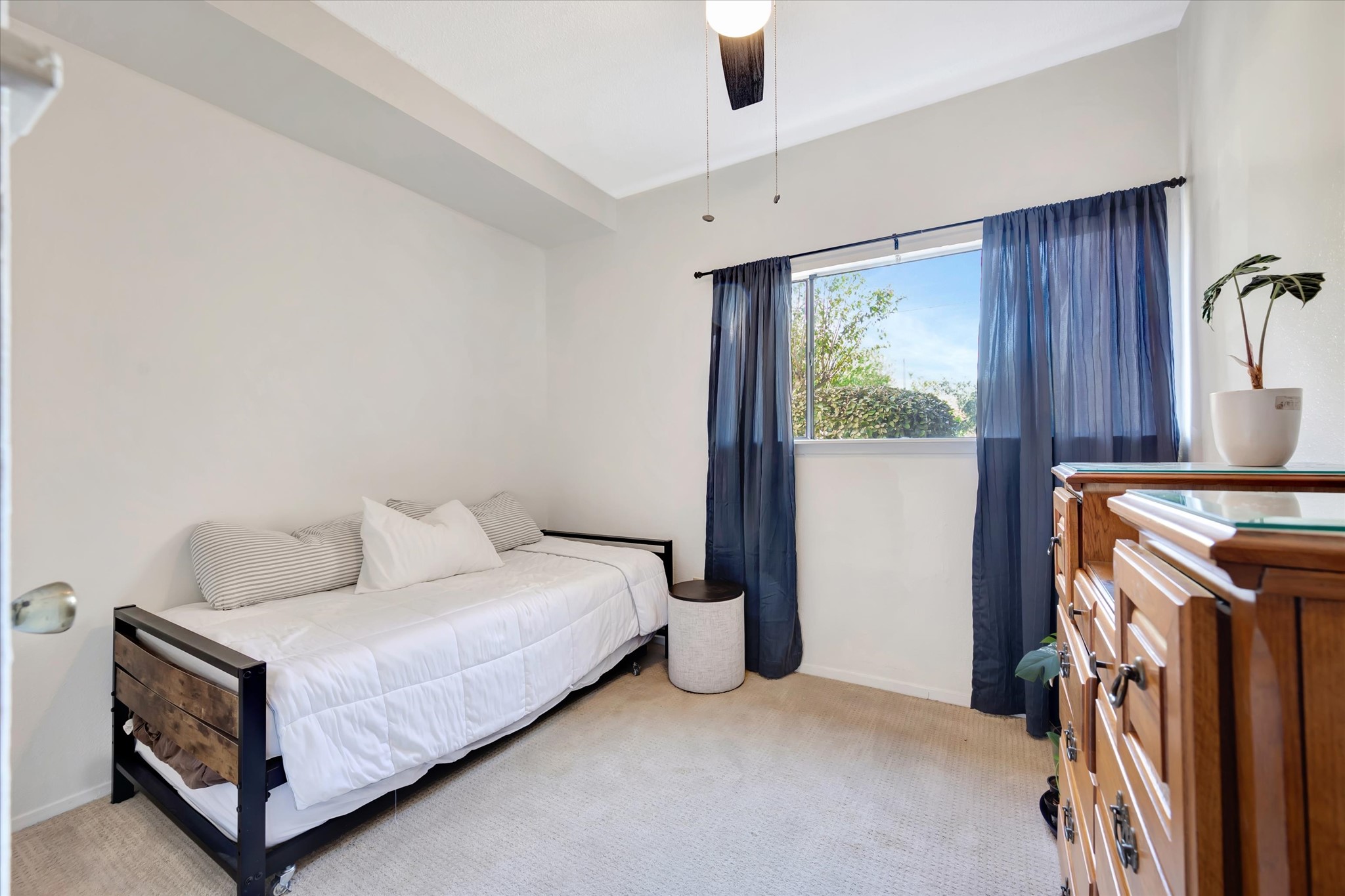 Secondary bedroom with a window and space for guest accommodations or a home office.