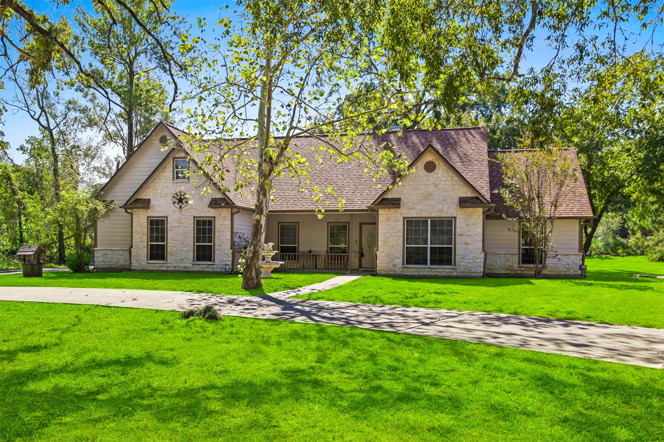 Charming home on 2.2 UNRESTRICTED acrea with a pond for true country living. Home was built in 2002 and both HVACS were replaced in 2026. Beautiful stone elevation with front porch.**Grass virtually enhanced** Charming home on 2.2 UNRESTRICTED acrea with a pond for true country living. Home was built in 2002 and both HVACS were replaced in 2026. Beautiful stone elevation with front porch.**Grass virtually enhanced**
