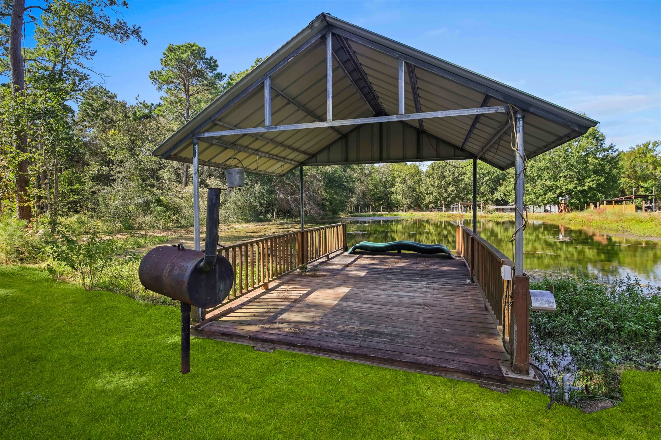 Relaxing is a breeze with a pavilion area right off the pond. This is perfect for eating, entertaining or just swinging by the sunset. **Grass virtually enhanced**