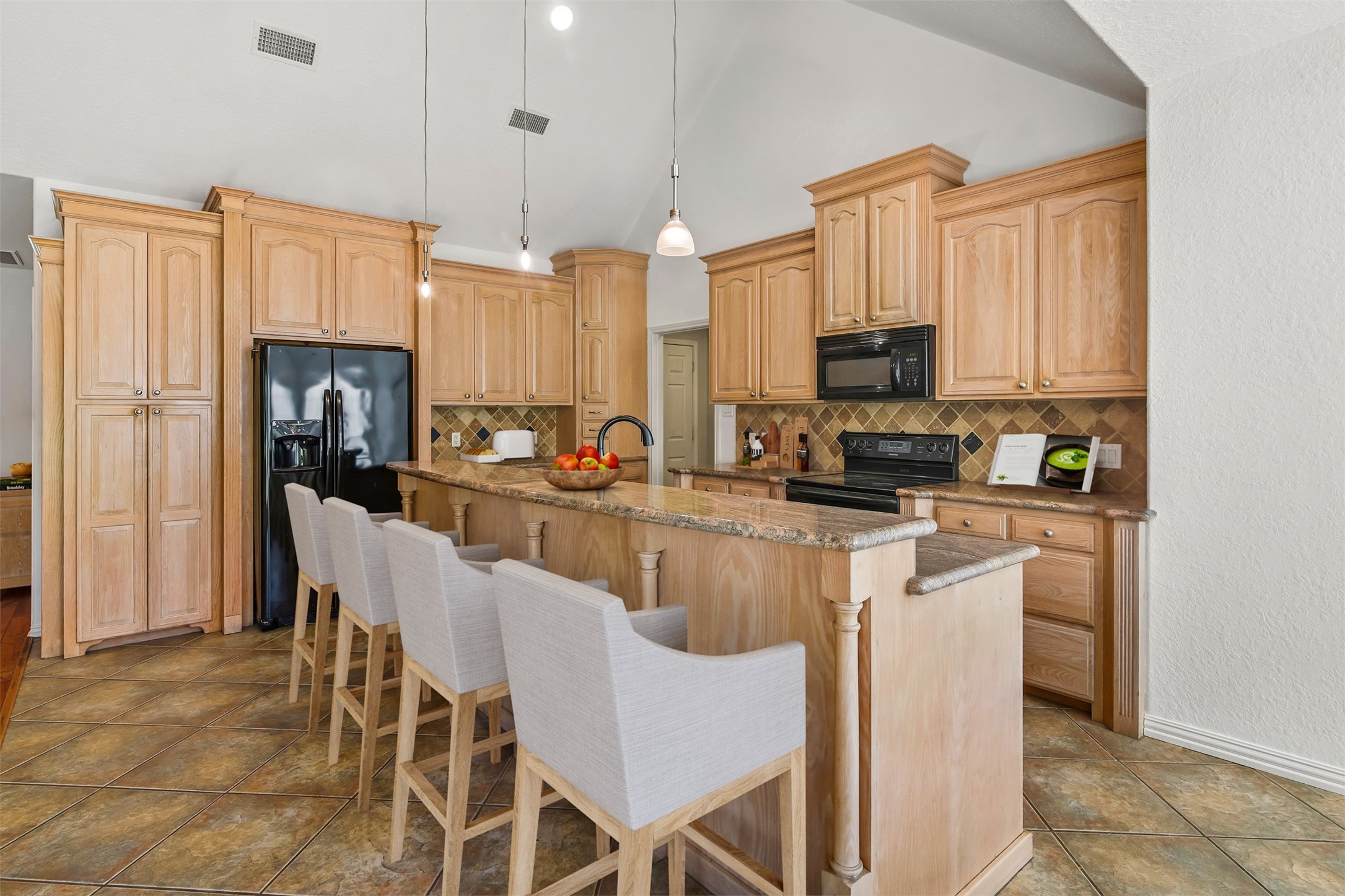 The kitchen is open to the family room which is perfect for entertaining.