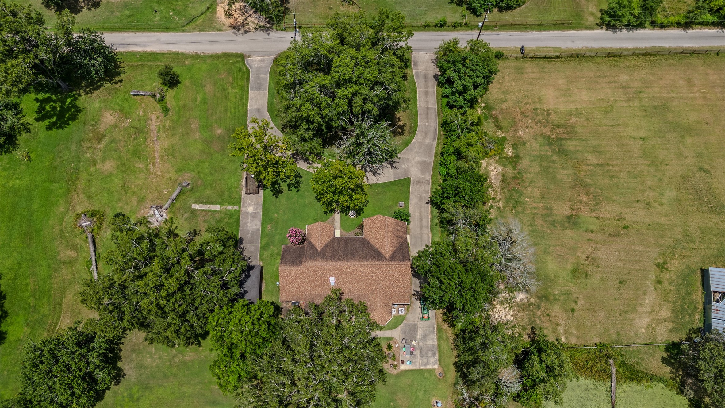 Aerial view of home and circle driveway.