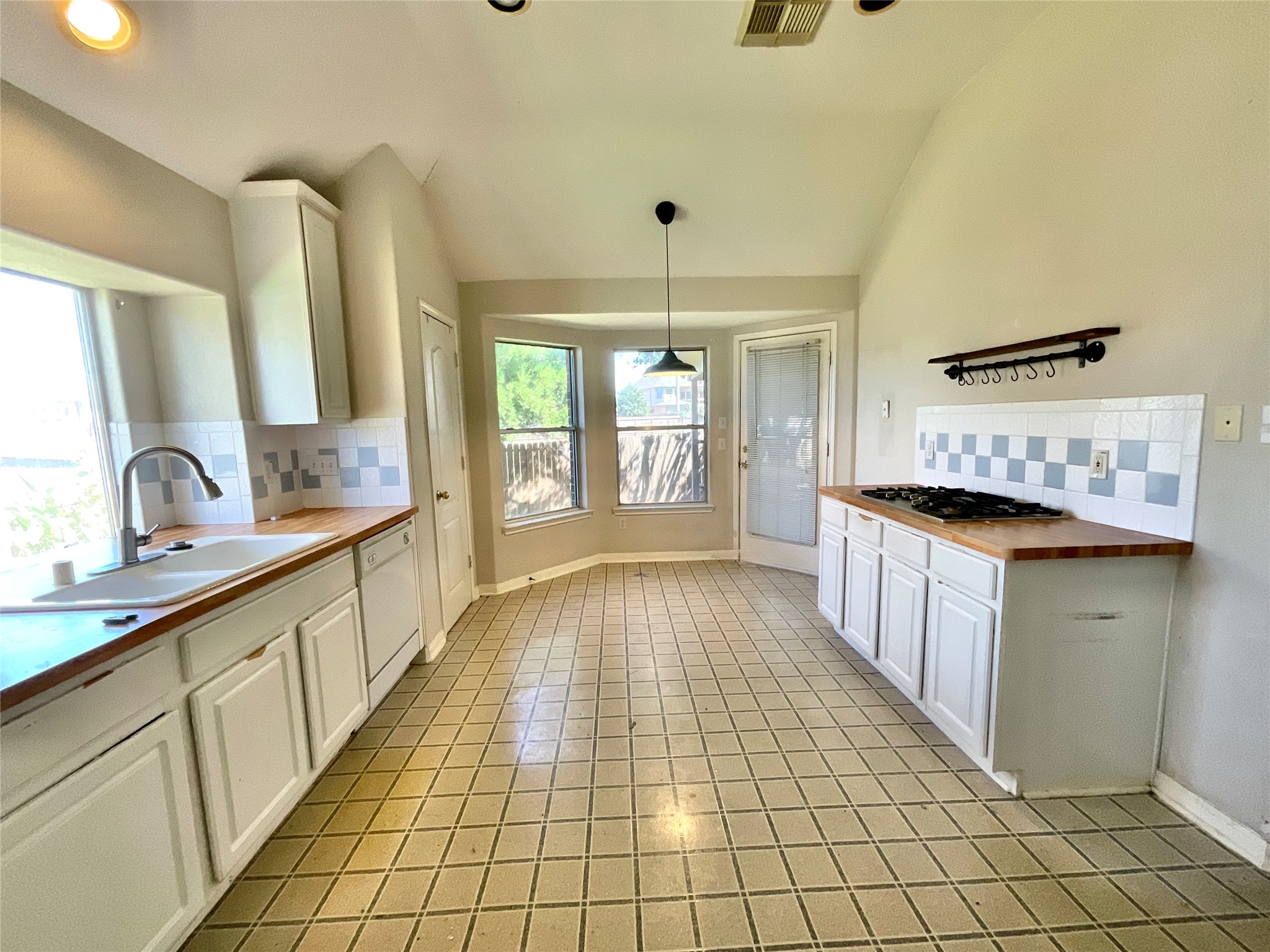 Kitchen view to back door exit Kitchen view to back door exit