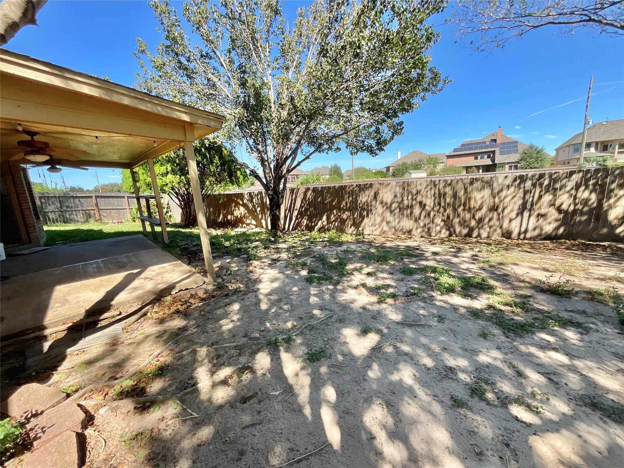 Covered back porch and yard.