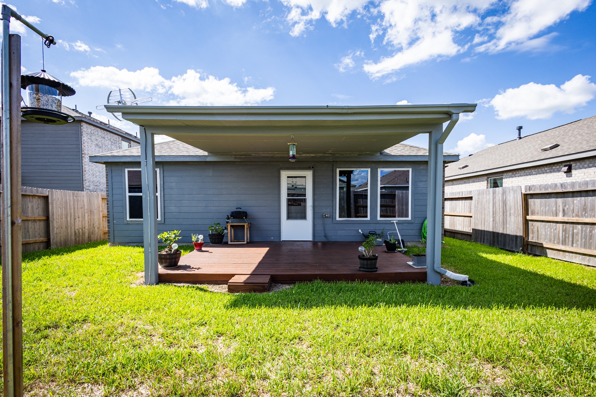 Escape the Texas sun beneath your newly built, premium covered backyard patio! A massive financial savings that provides a true outdoor living room.