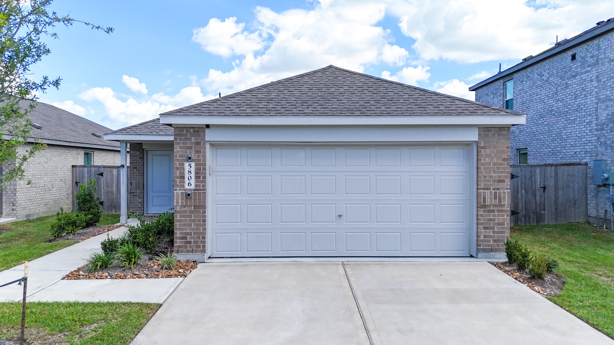 Welcome home to 5806 Standpiper Loop! A striking, newly built ranch-style facade with pristine curb appeal, situated in the booming Pelly Place community.