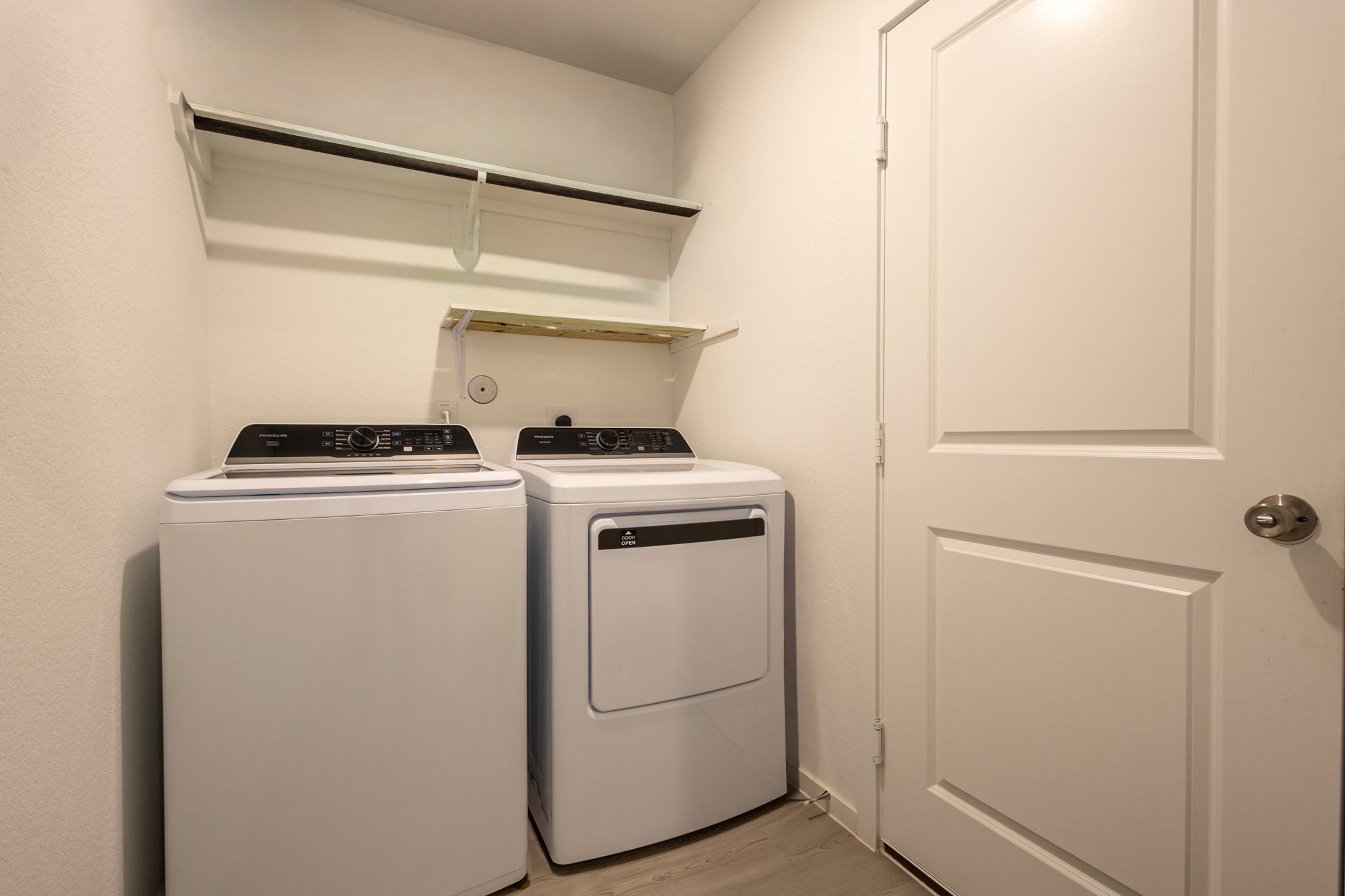Conveniently located, dedicated indoor utility room complete with built-in overhead storage shelving to make organization a breeze.