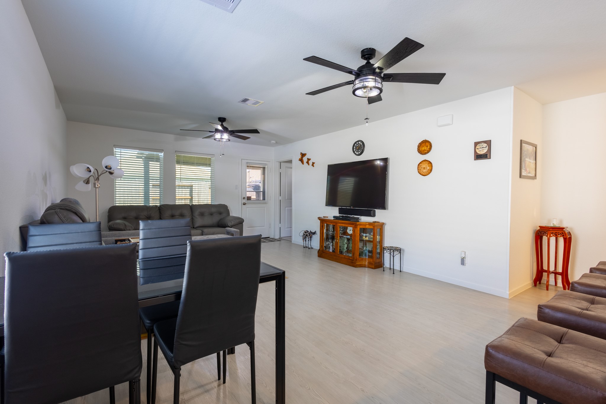 The versatile dining space integrates flawlessly into the floor plan, comfortably accommodating a large dining table for festive holiday gatherings.