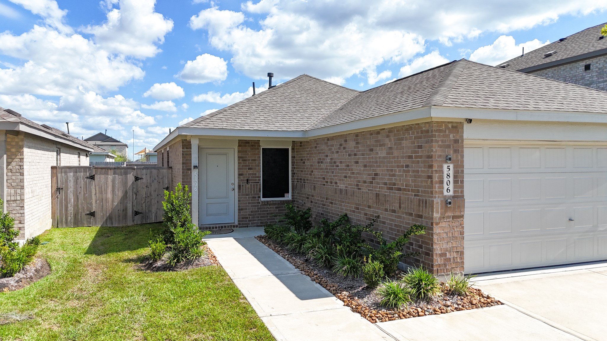 A welcoming, low-maintenance front entry porch sets the tone for the clean lines and meticulous care found throughout the entire property.