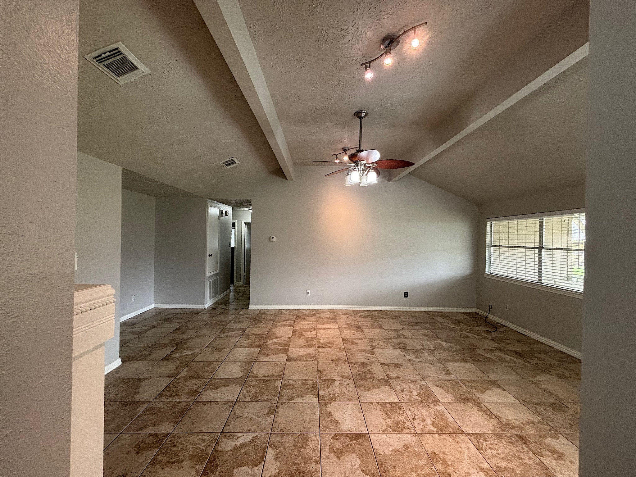 Enjoy abundant natural light streaming through large windows, creating a bright and inviting atmosphere.
