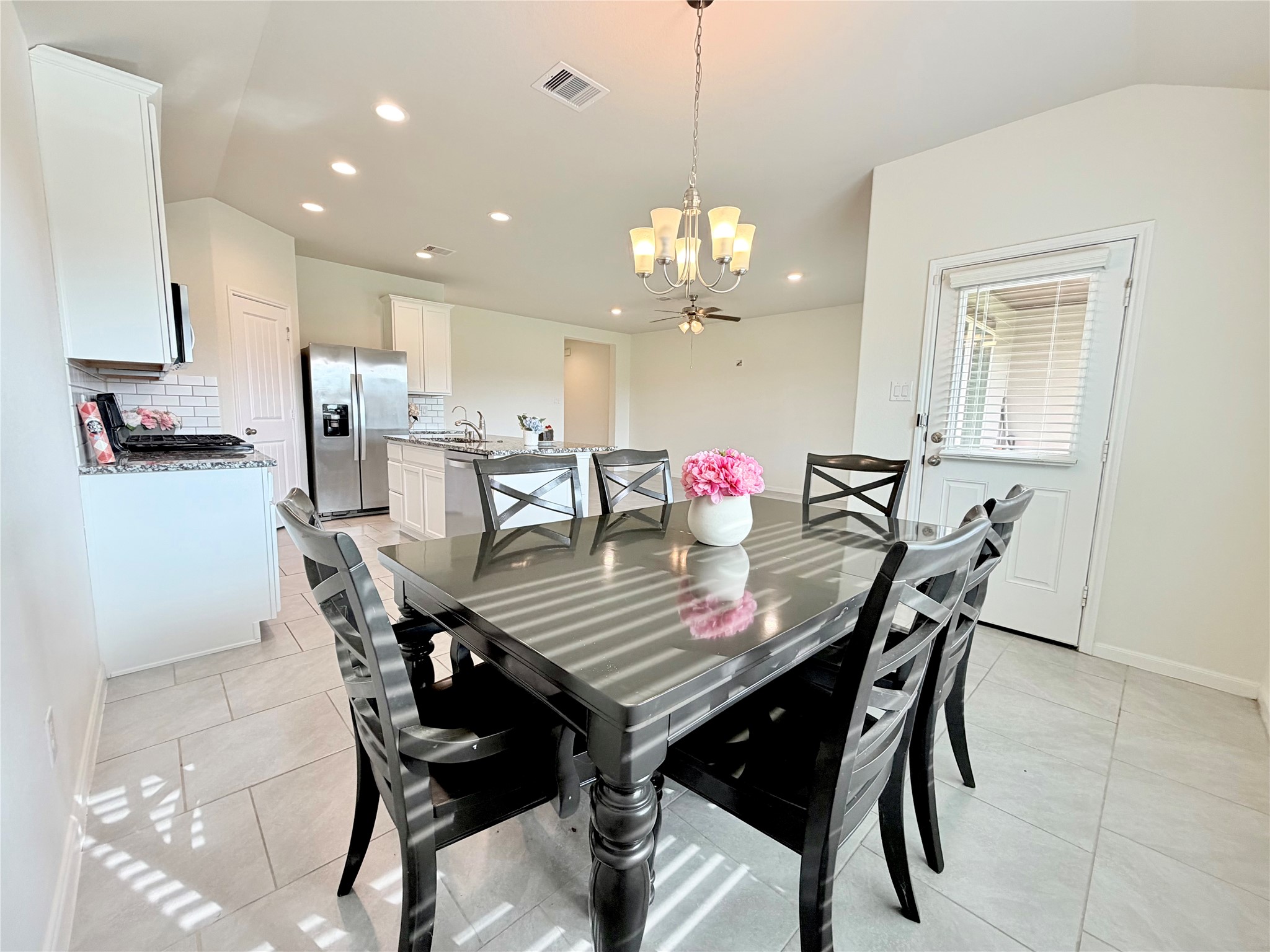 Inviting dining area with seamless flow into the kitchen and open living spaces. Inviting dining area with seamless flow into the kitchen and open living spaces.