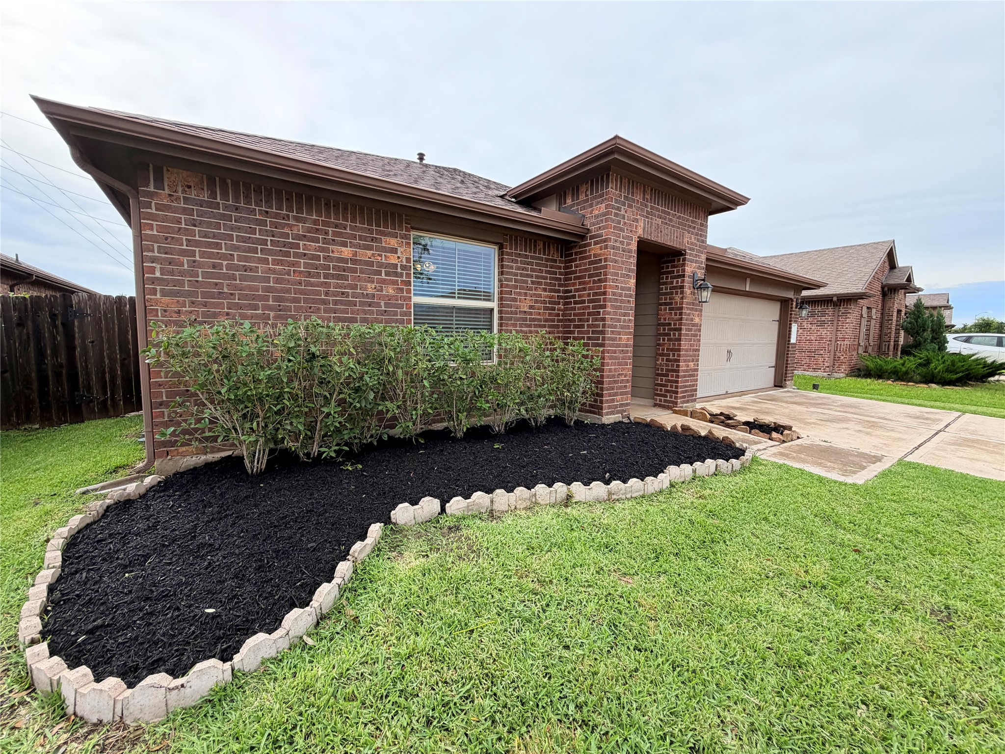 Fresh mulch and neatly trimmed landscaping create a welcoming first impression.