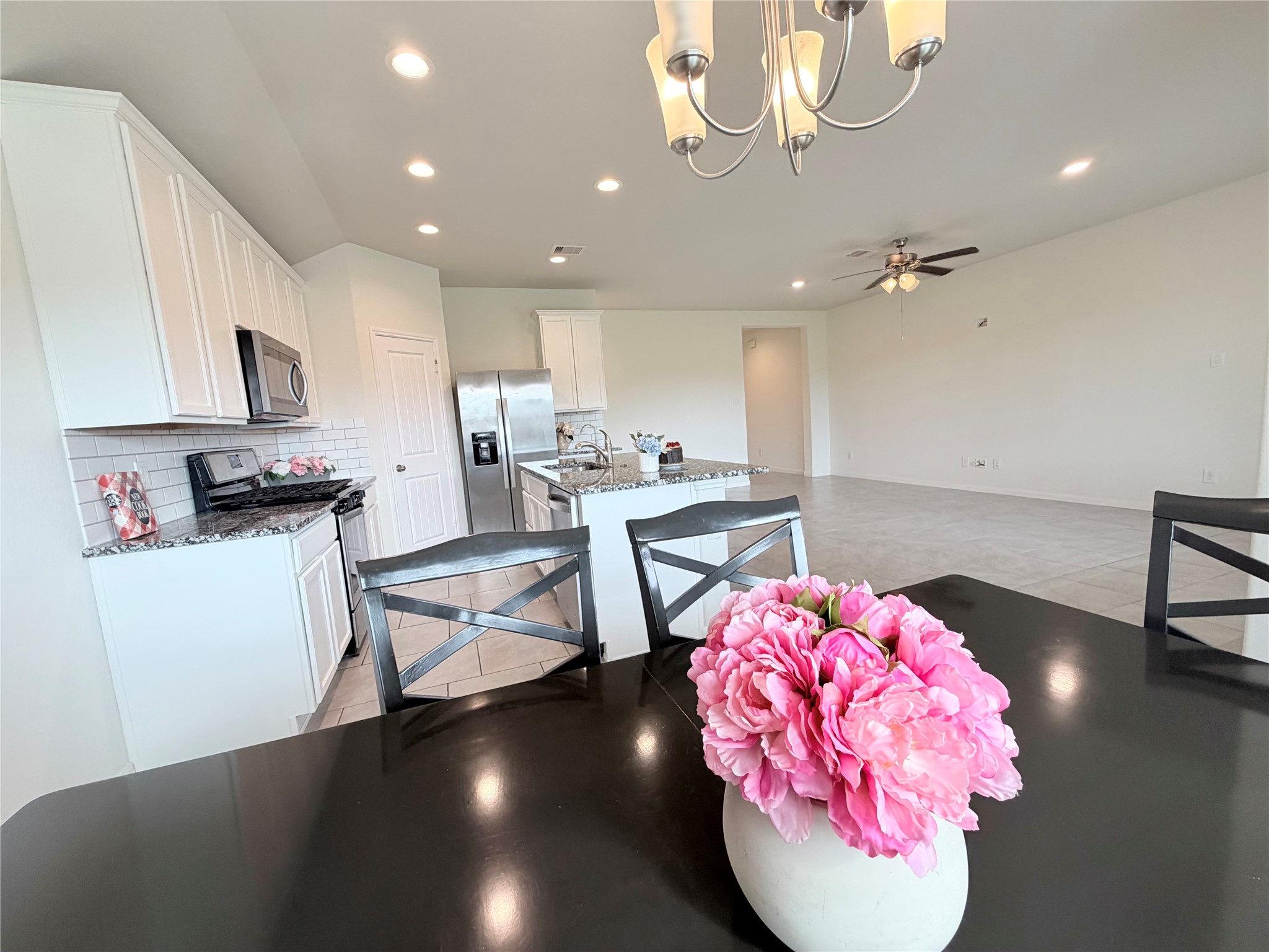 Dining area opens seamlessly to the kitchen and living spaces.
