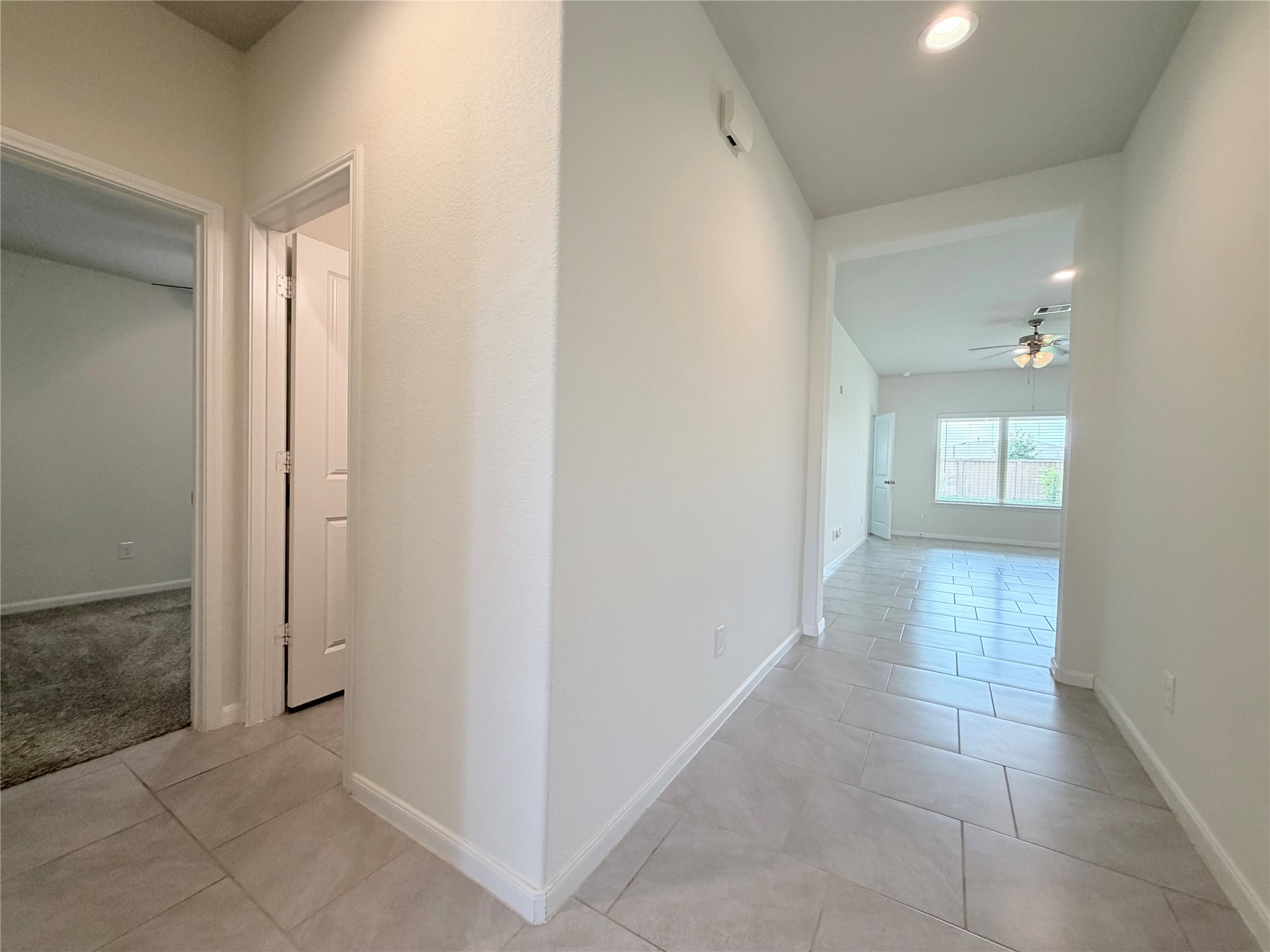 Door on the left is the hall bathroom, next to bedrooms 2 and 3.