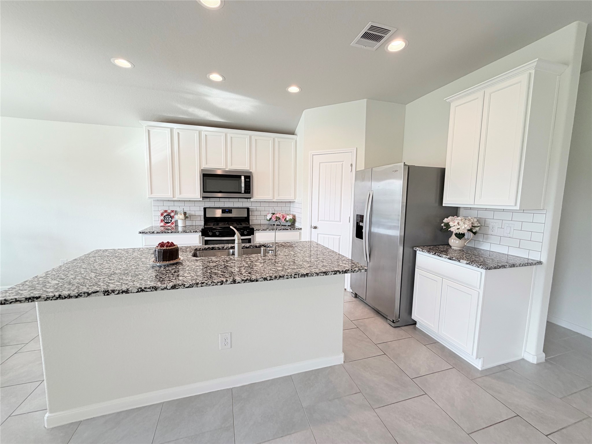 Expansive island offers additional seating- perfect for morning coffee, casual meals, or gathering with guests. Expansive island offers additional seating- perfect for morning coffee, casual meals, or gathering with guests.