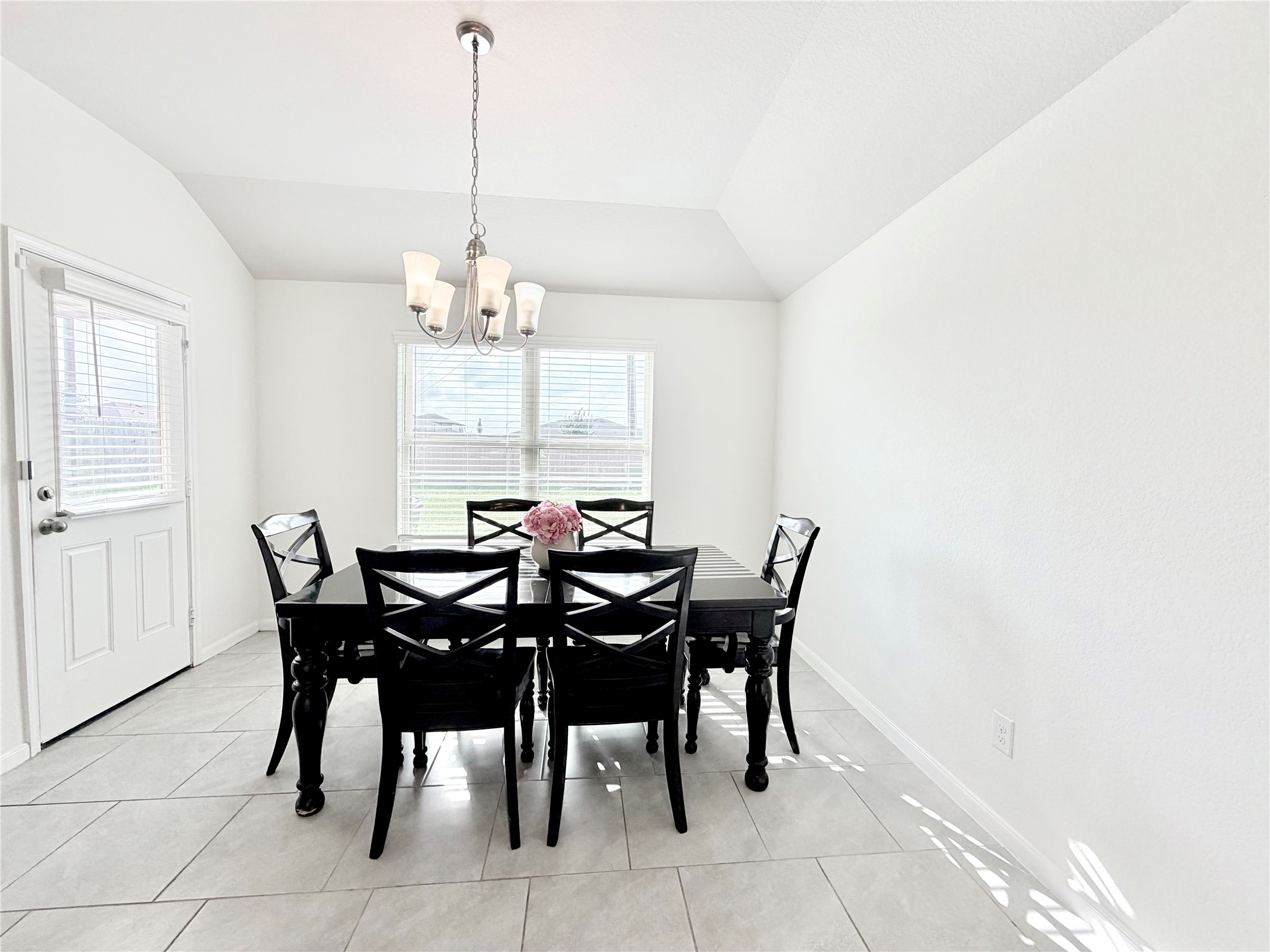 Gather family and friends in the spacious dining area, perfectly positioned between the kitchen and living room.