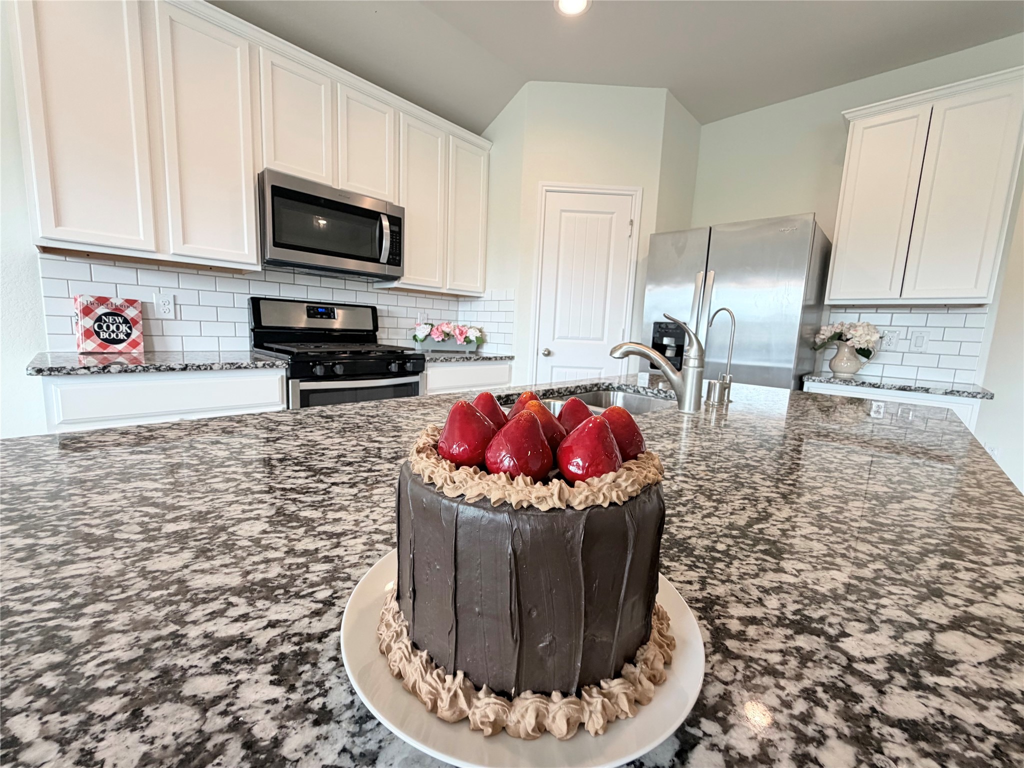 Granite countertops provide abundant workspace for meal preparation and gathering. Granite countertops provide abundant workspace for meal preparation and gathering.
