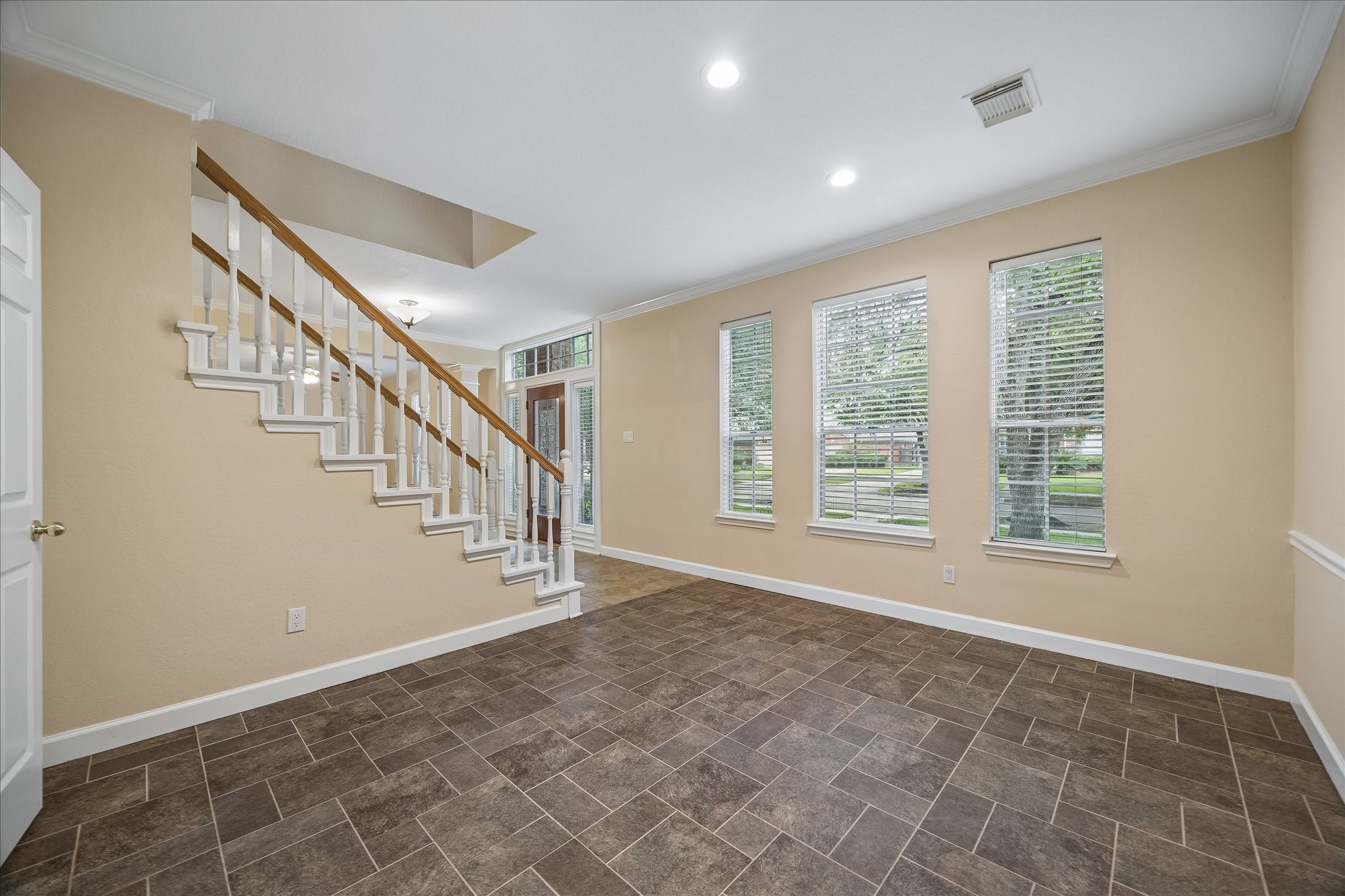 And this is a view of the dining room looking towards the foyer.  The door you can barely see on the left leads  to the kitchen.  Fresh paint throughout.