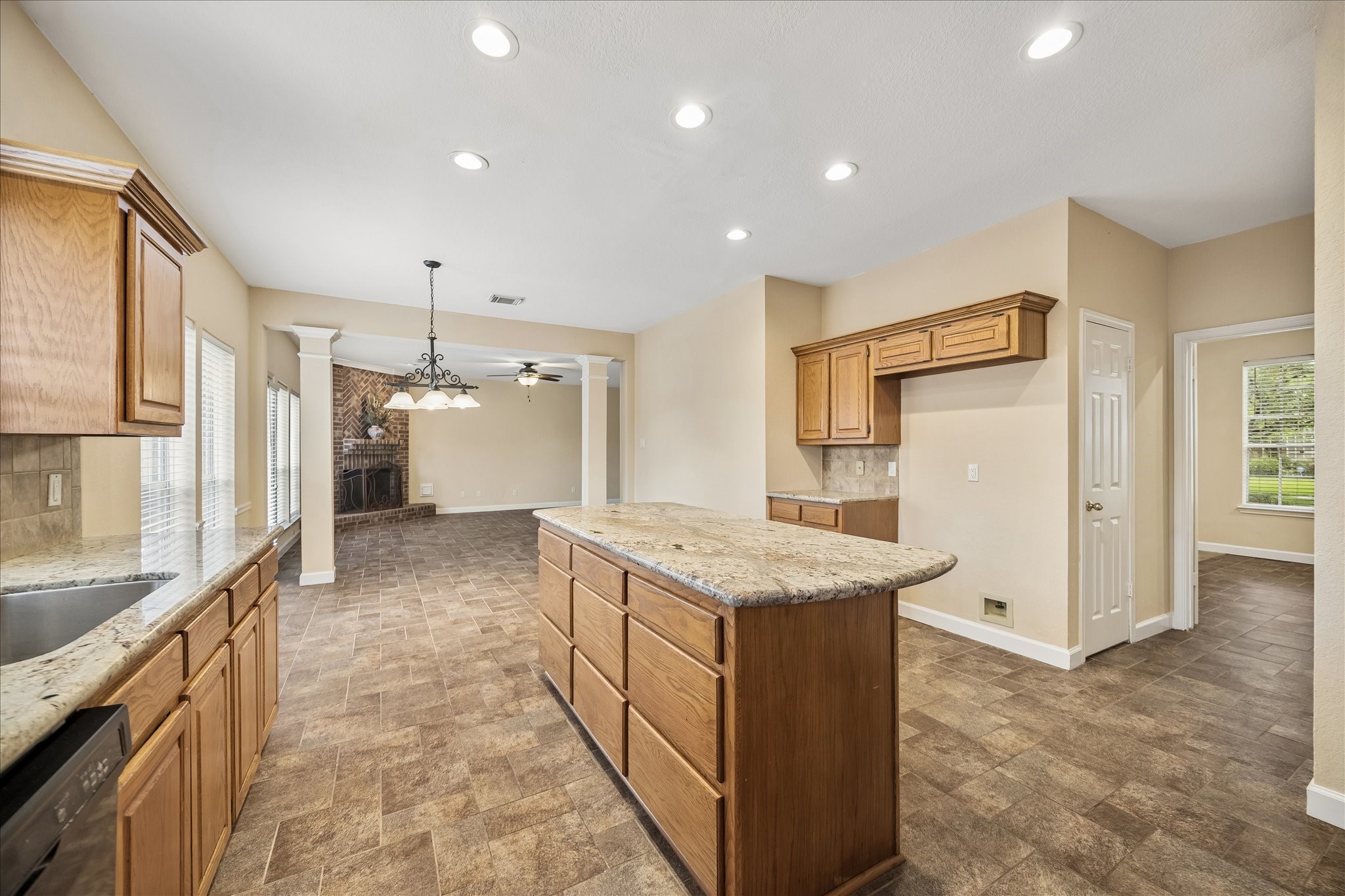 And this view essentially from the back door, looks to the breakfast room and family room.  The door on the right leads to the large walk-in pantry.  And the far right is the dining room.