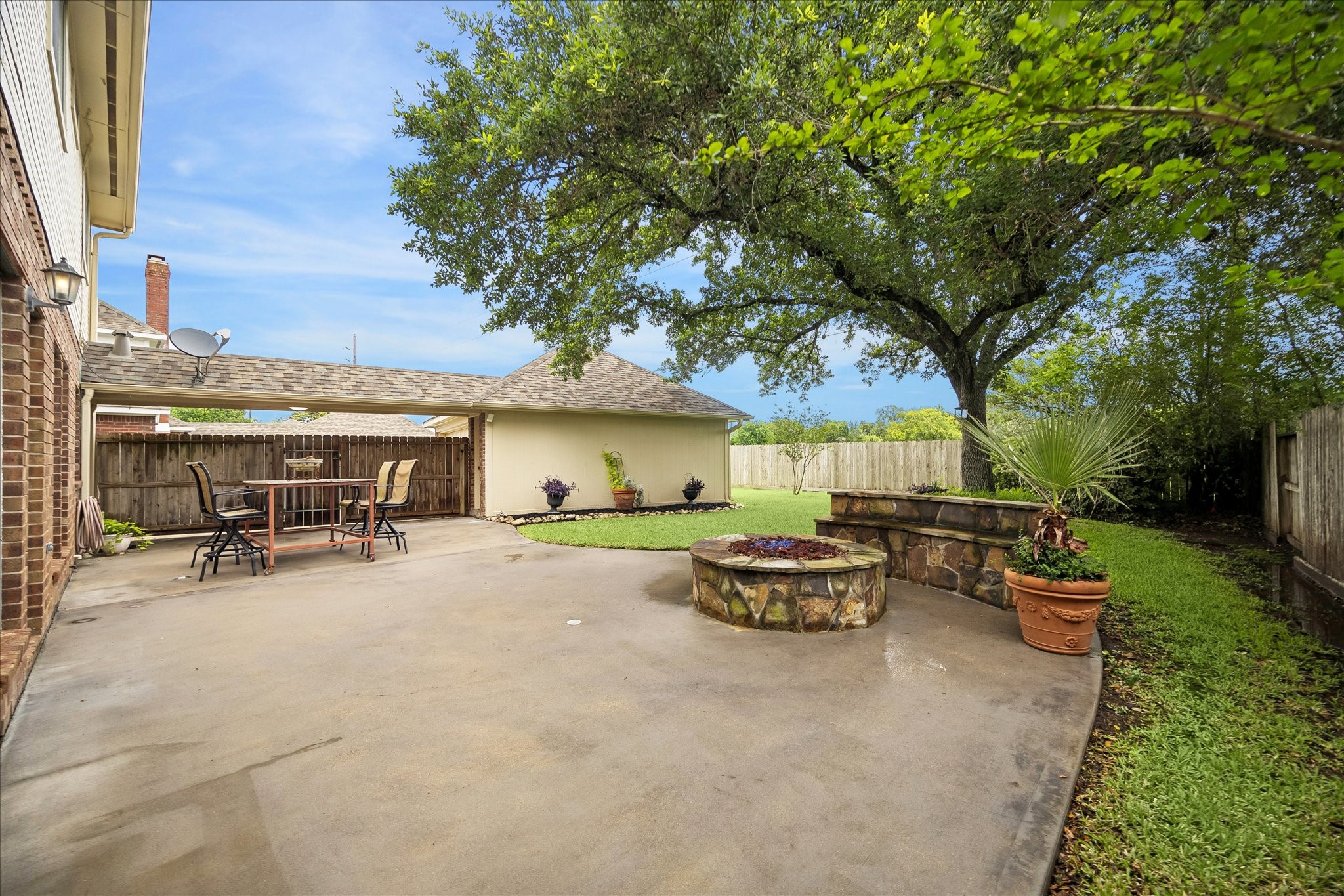 And a look from the back side of the house towards the gas firepit.  Plenty of grass for kids and pets to run around.  And again, no back neighbors!