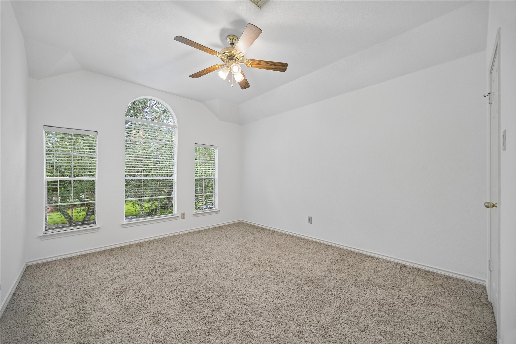 And this is one of the 3 secondary bedrooms upstairs.  The windows look out to the front.  The closet on the right is a generous size.