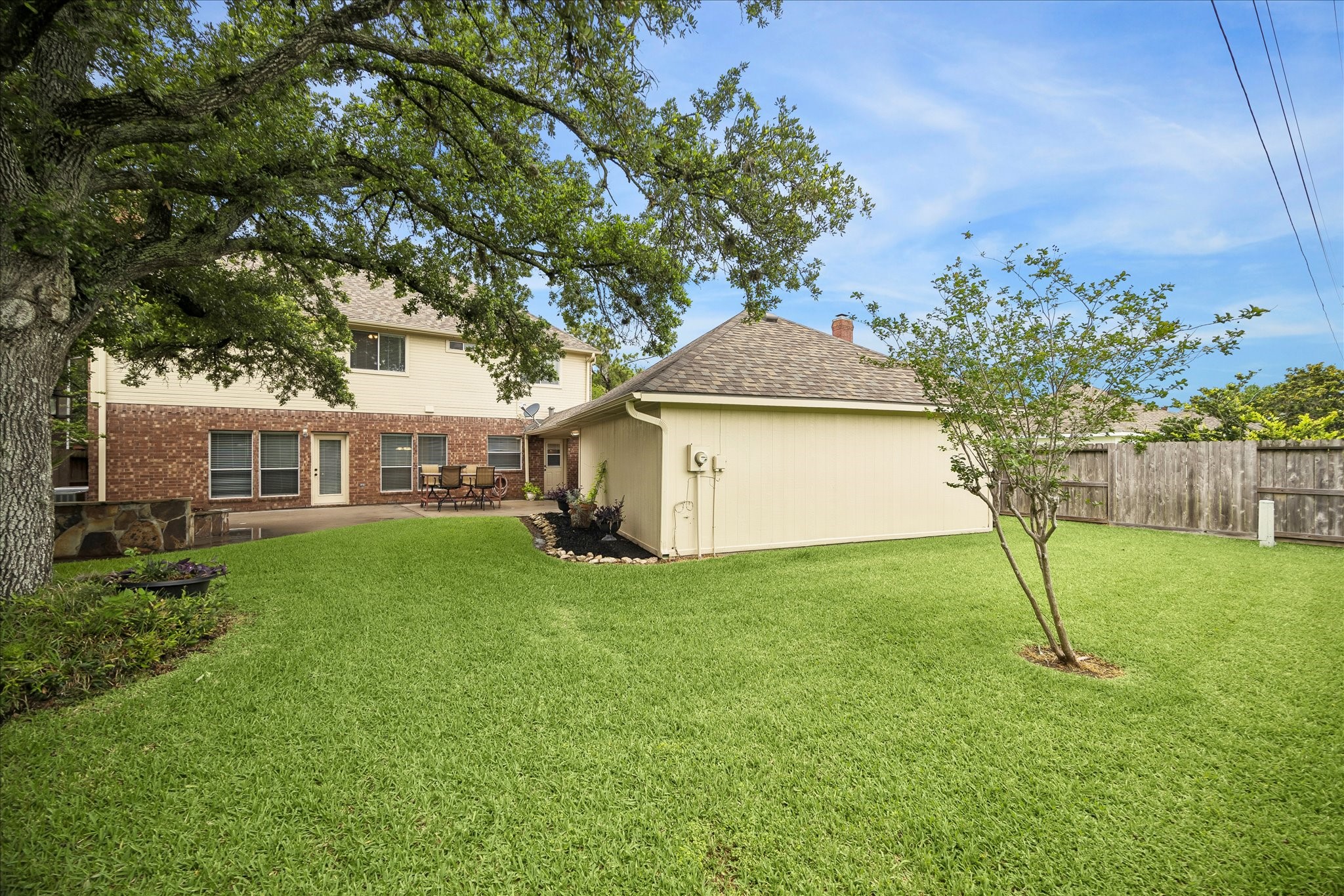 And another view of the backyard that extends behind the garage.  Great place to put a garden!   This home is zoned to top-rated schools - Colony Meadow Elementary, Settlement Middle School & Clements High School.  And easy access to Hwy 59, Hwy 6, Hwy 90 & 99 Tollway.  And tons of restaurants, shopping and entertainment!