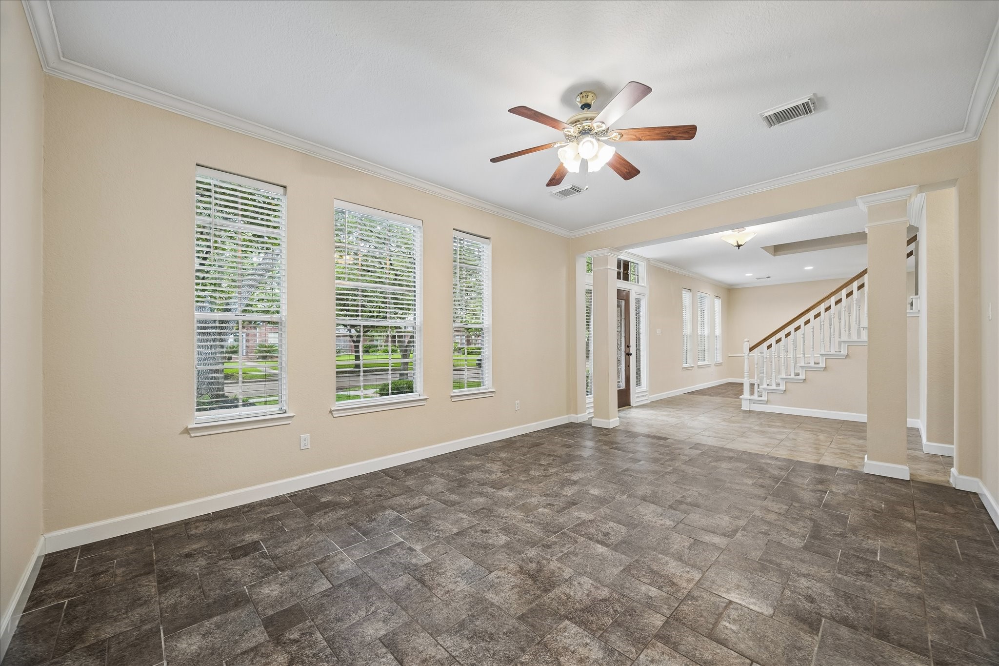 And now we are over in the study/office.  Could be used as a formal living room as well.  Tile flooring throughout the first floor.  There are 2 A/C units and were replaced in 2019 and 2021, respectively.  The entire duct work was replaced in 2023.