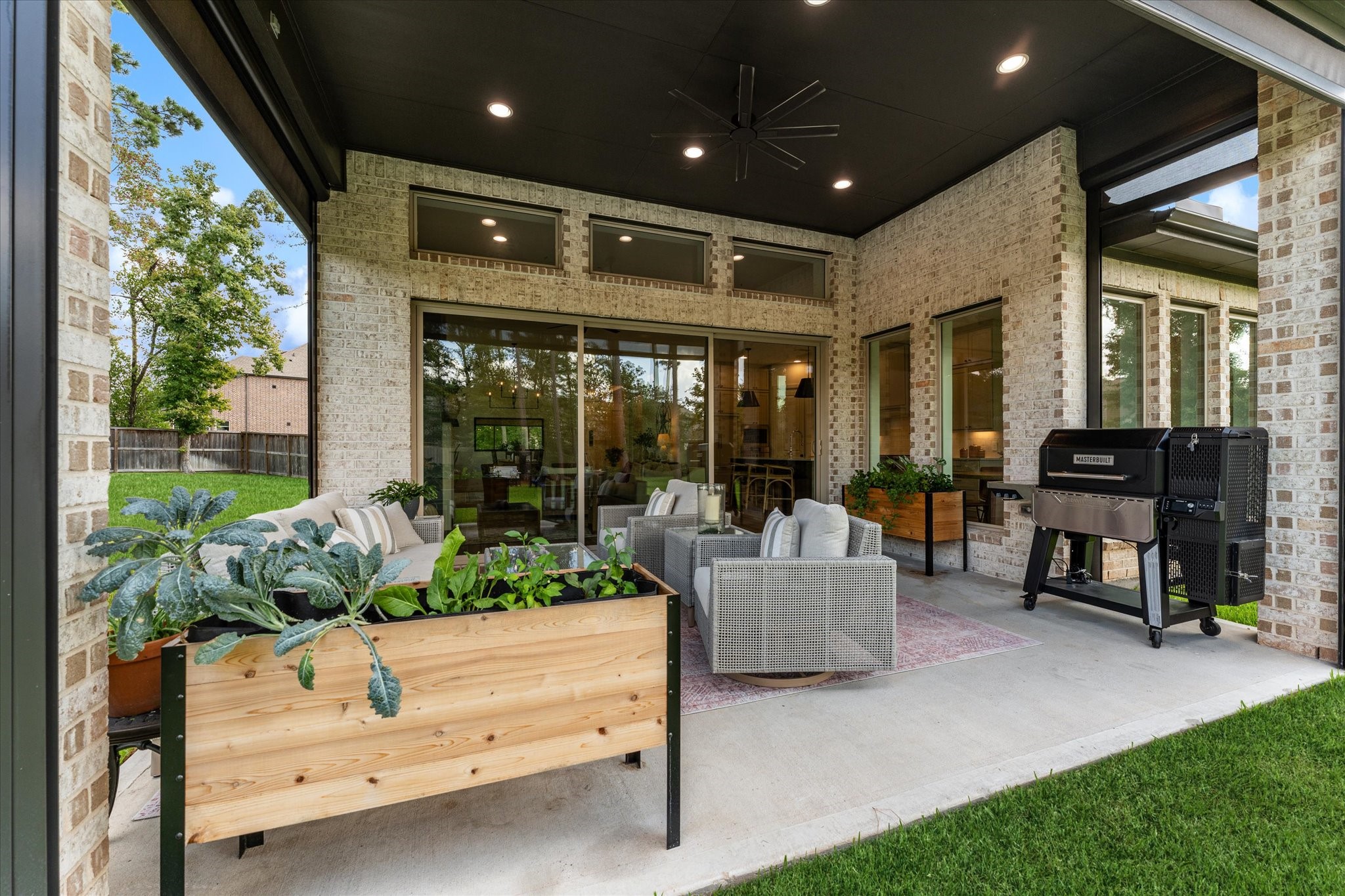 Extended covered patio complete with remote screens