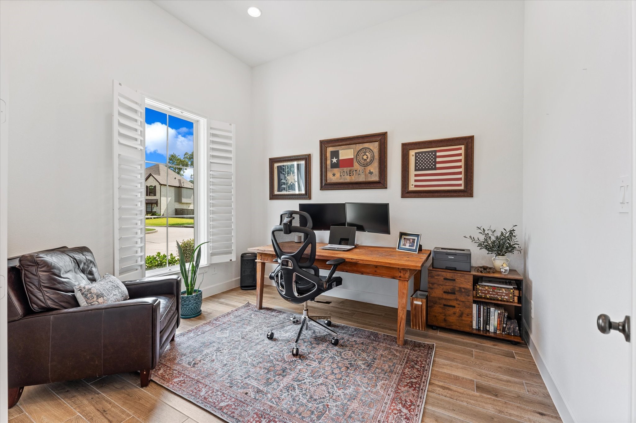 Light filled private office with French doors & plantation shutters