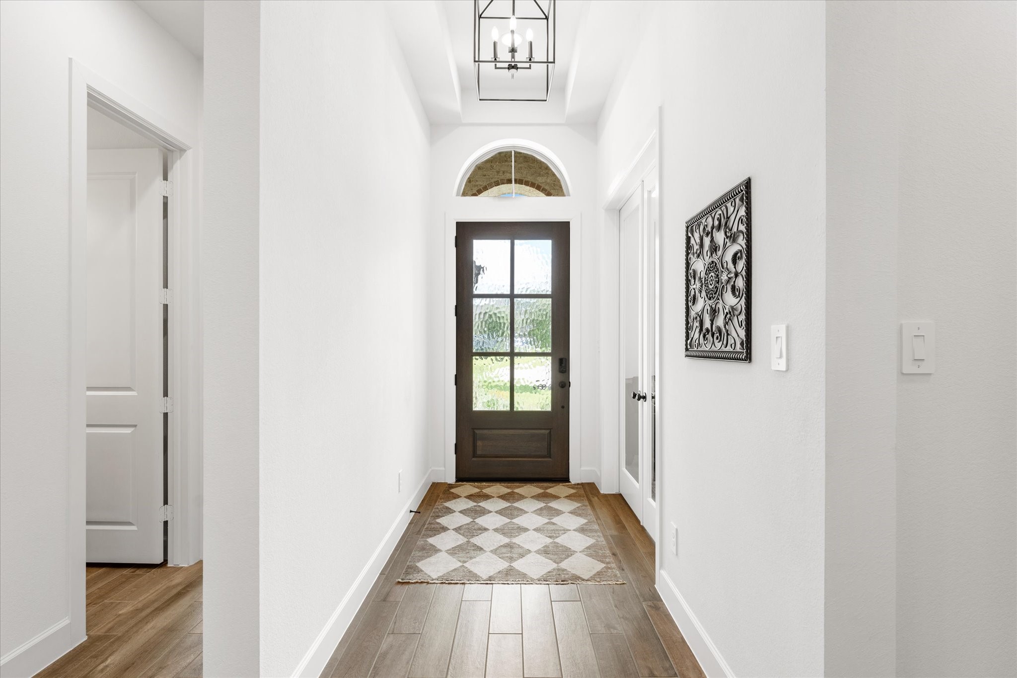 Hall entry with 2 bedrooms & full bath to left