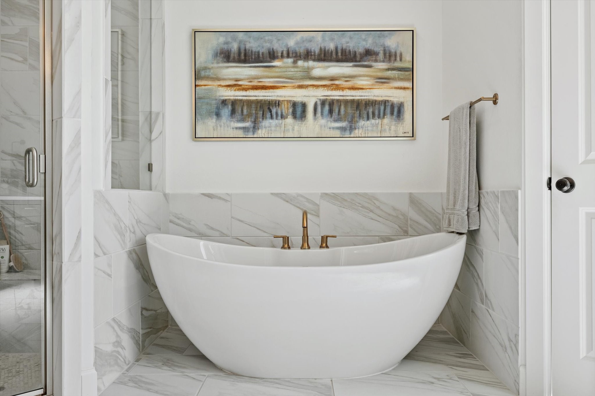 Freestanding tub with champagne bronze fixtures