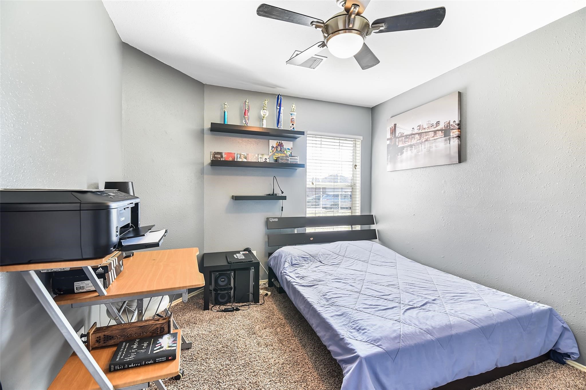 View of the secondary bedroom before the recent neutral paint