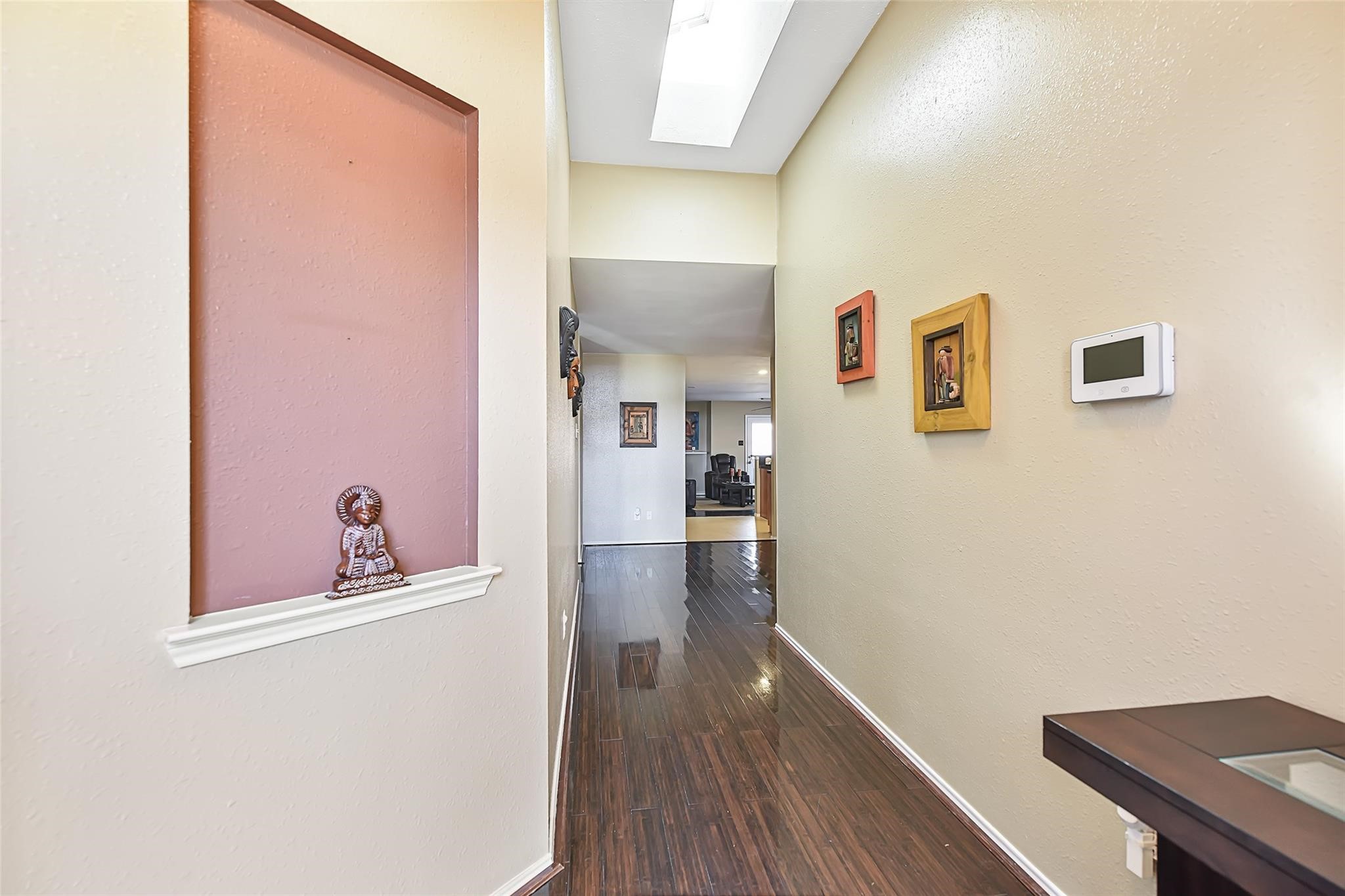 View of the entry way before the recent neutral paint