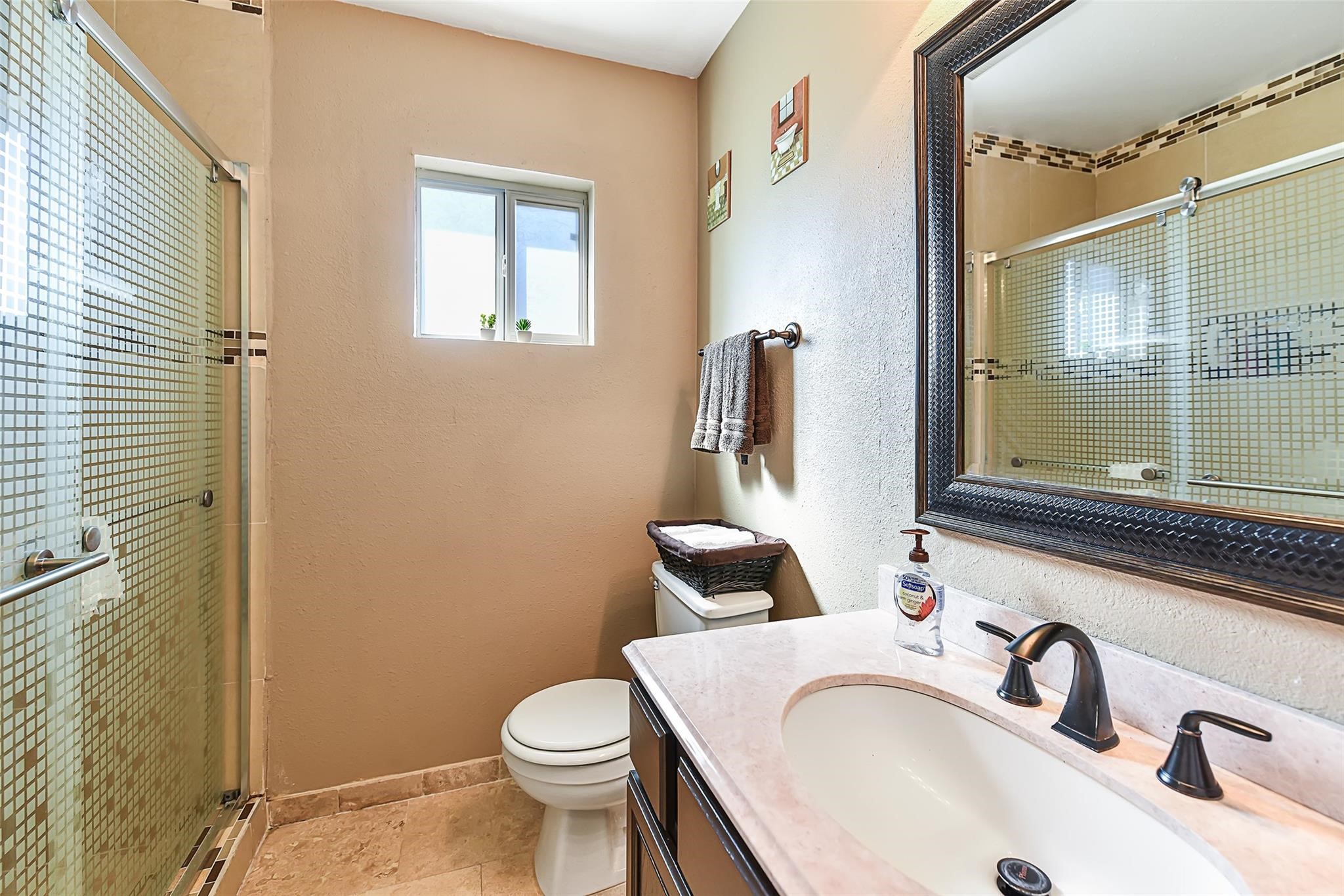 View of the secondary bathroom before the recent neutral paint