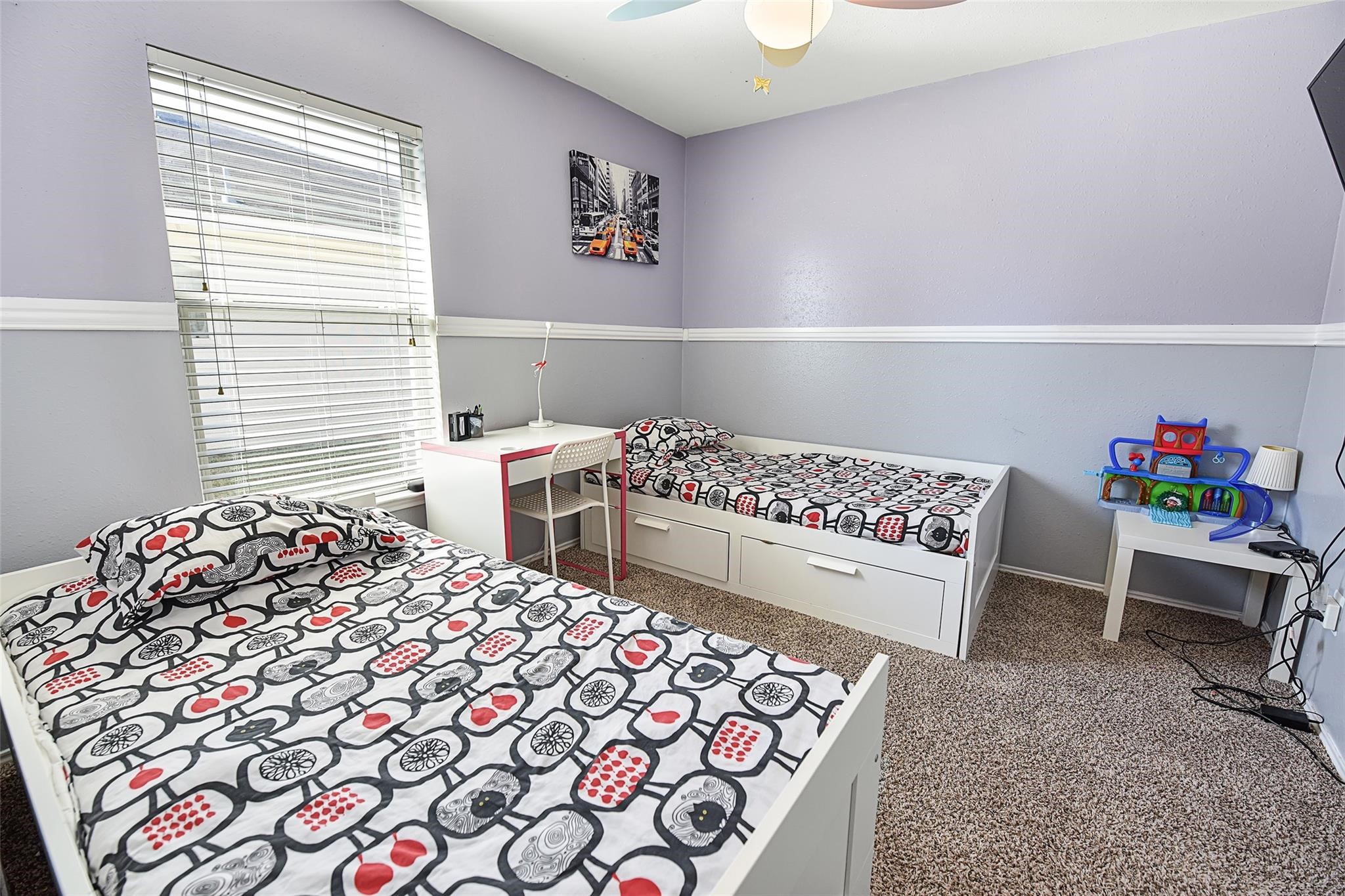 View of the secondary bedroom before the recent neutral paint