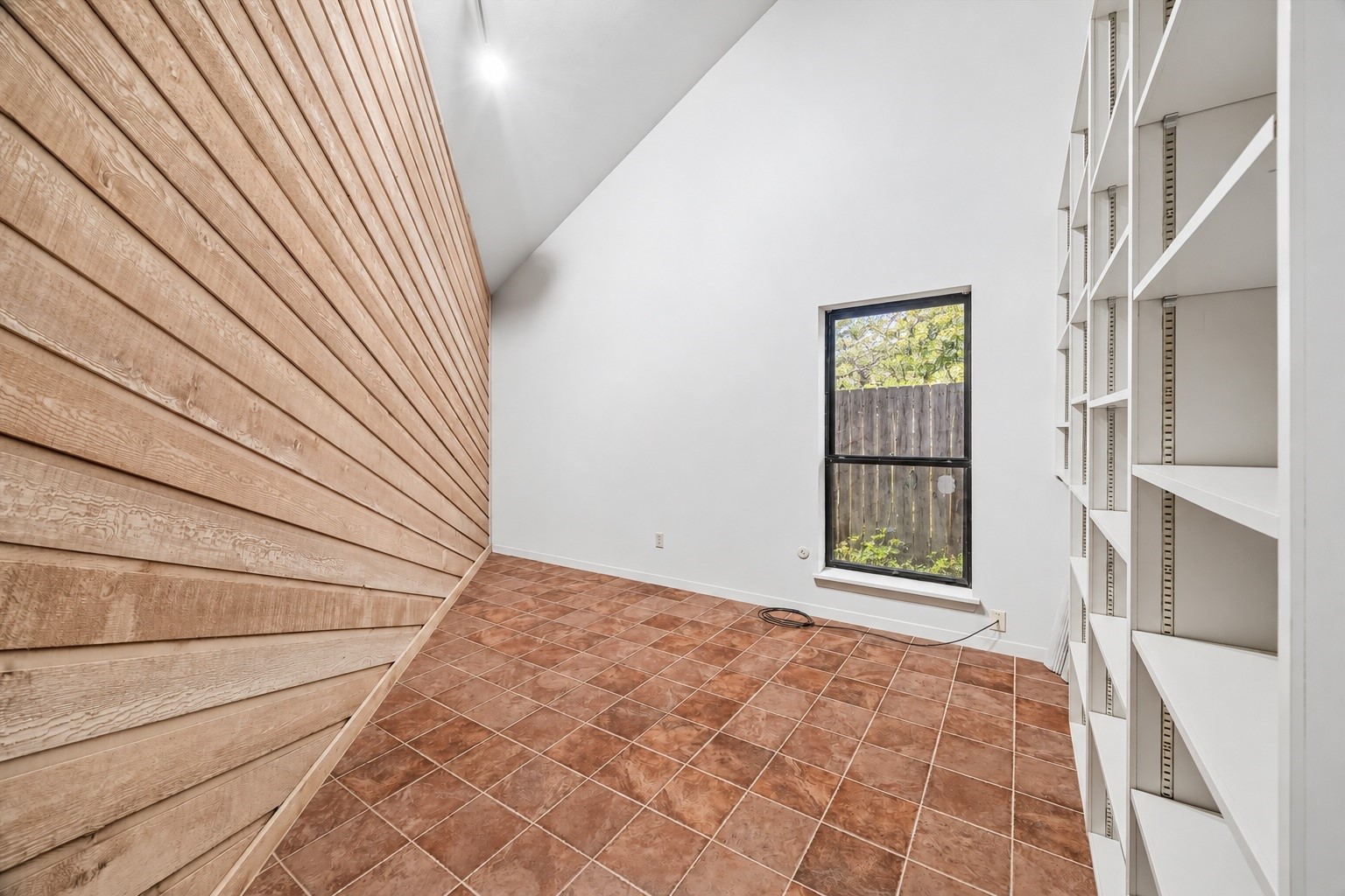 Downstairs home office with wall of bookcases.