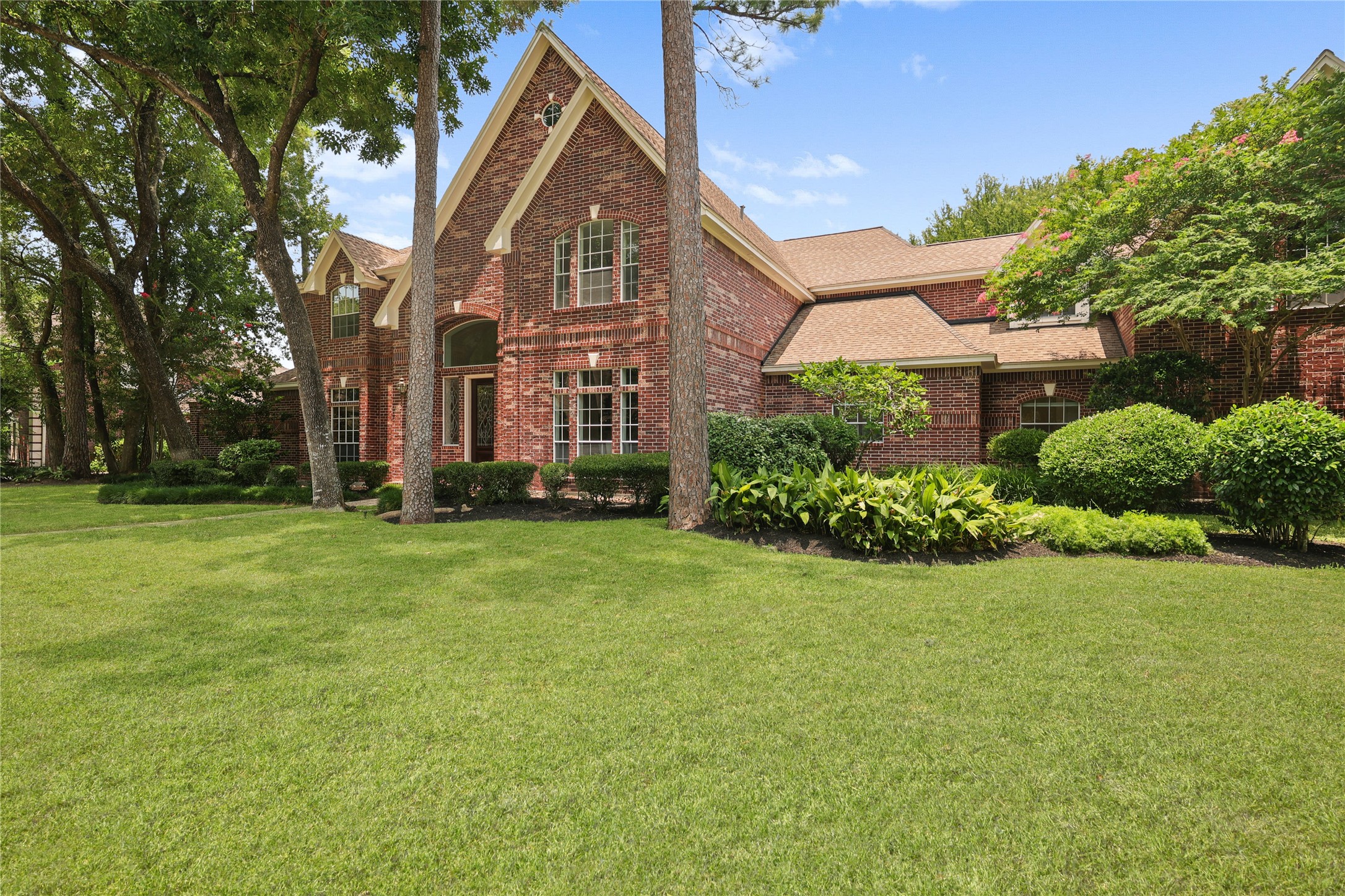 Beautifully manicured landscaping welcomes you home. Beautifully manicured landscaping welcomes you home.