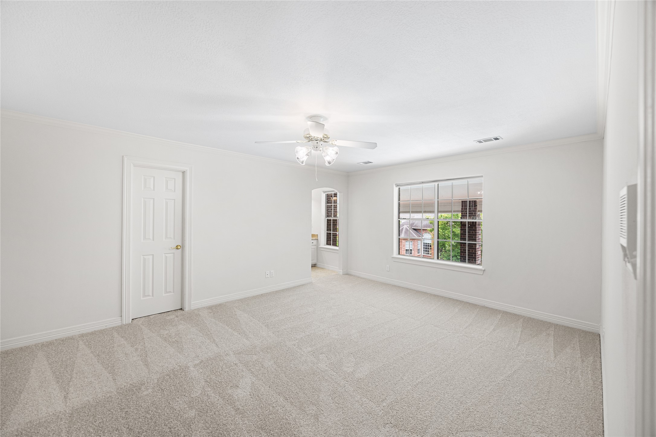Another spacious bedroom offering comfort for family or guests.
