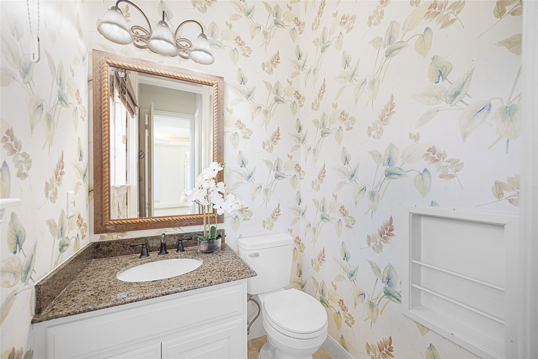 Well appointed power room located near backyard/pool area
