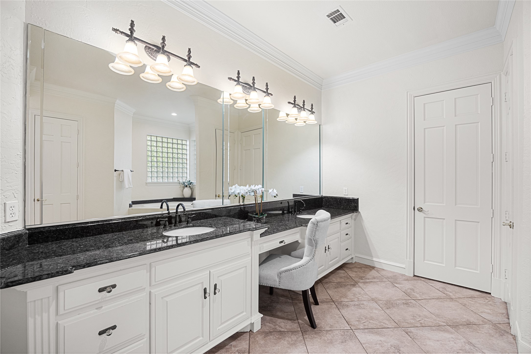 Tucked away walk-in shower and abundant counter space.