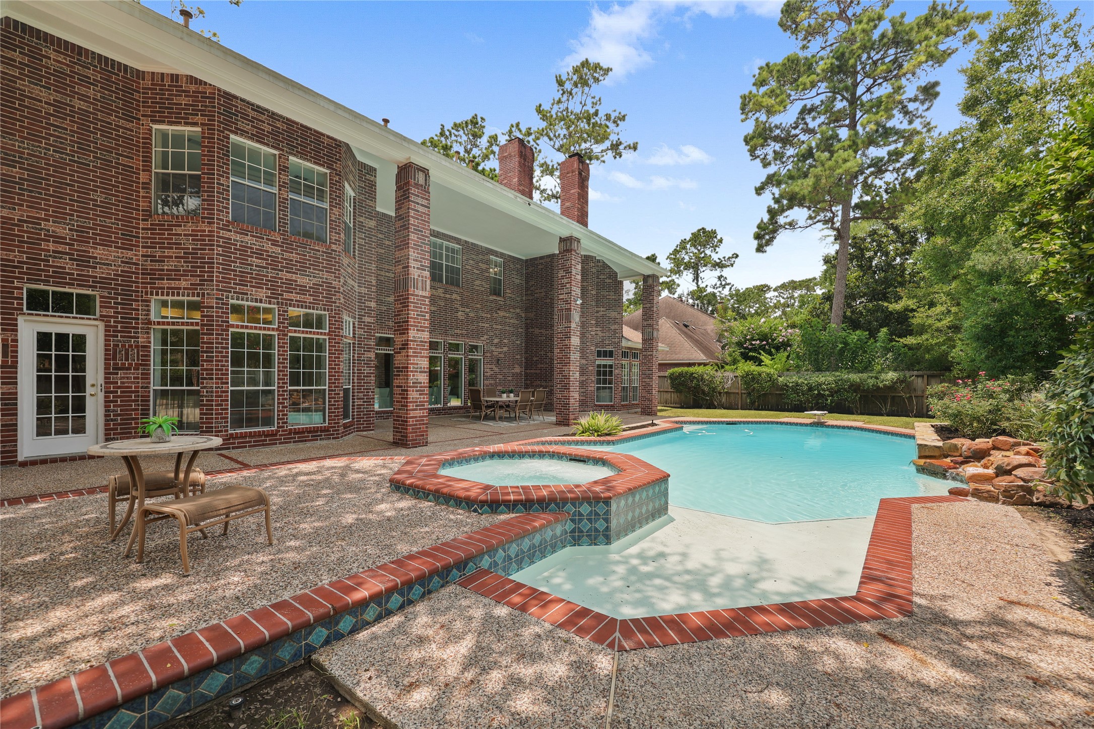 Exceptional backyard retreat combines luxury, privacy, and year-round enjoyment.