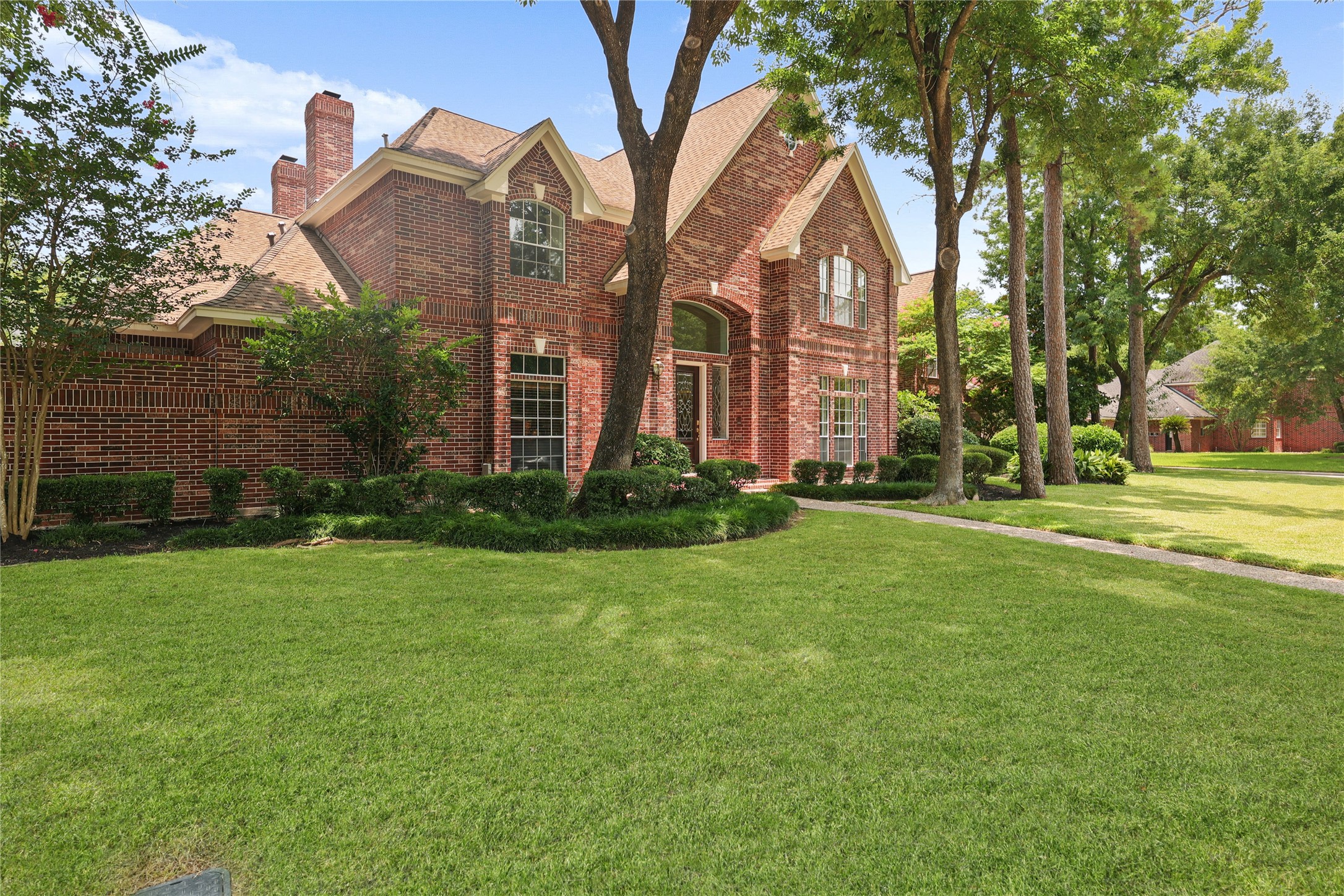 Grand front elevation showcasing elegant design on an oversized corner lot. Grand front elevation showcasing elegant design on an oversized corner lot.